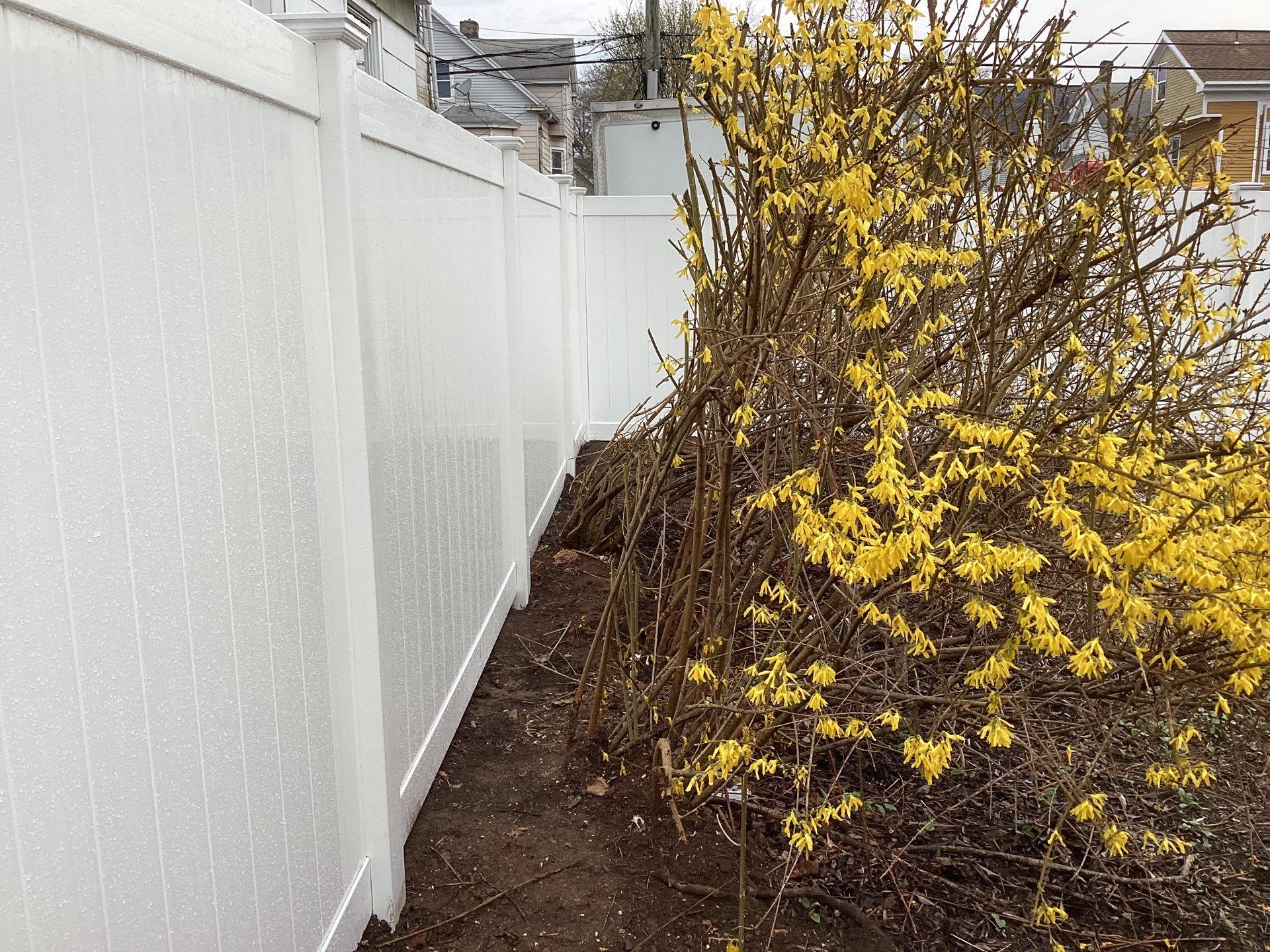 Fence replacement with white Vinyl privacy fence. by DiGiorgi Roofing and Siding Inc