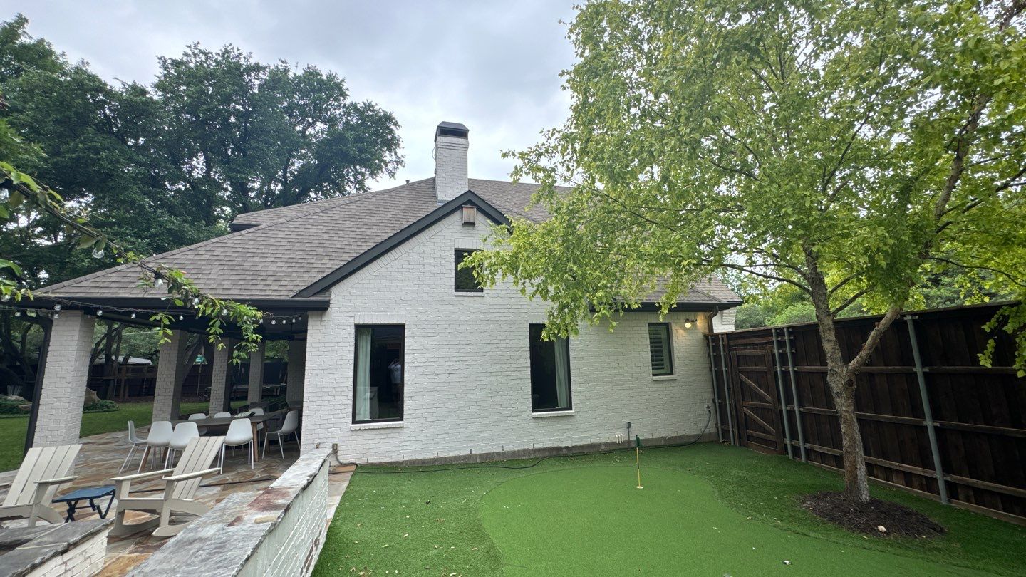 White brick with GAF Weathered Wood by Tejas Roofworks + Restoration