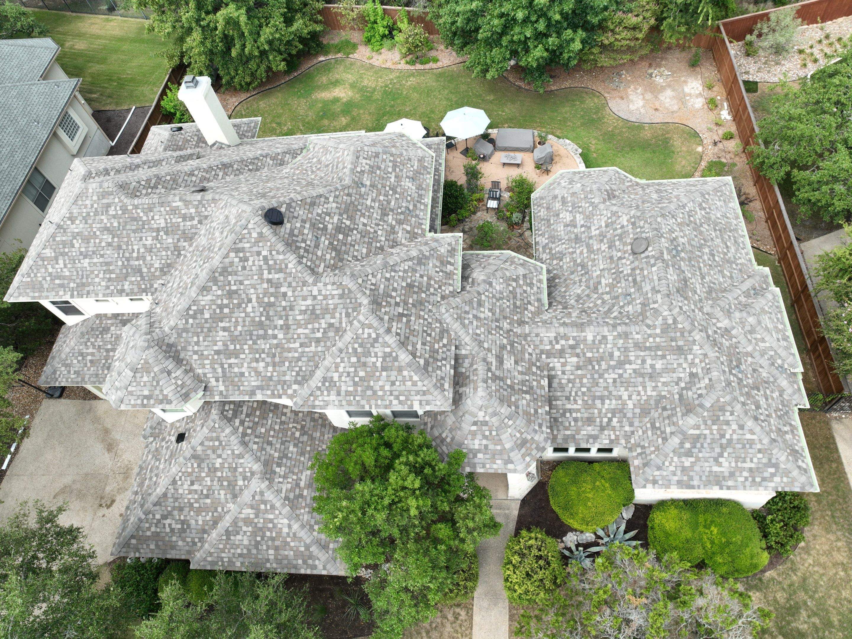 Residential Roof Replacement using 30 Year Laminate Shingles with High Profile Ridge by Premier Roofing and Contracting