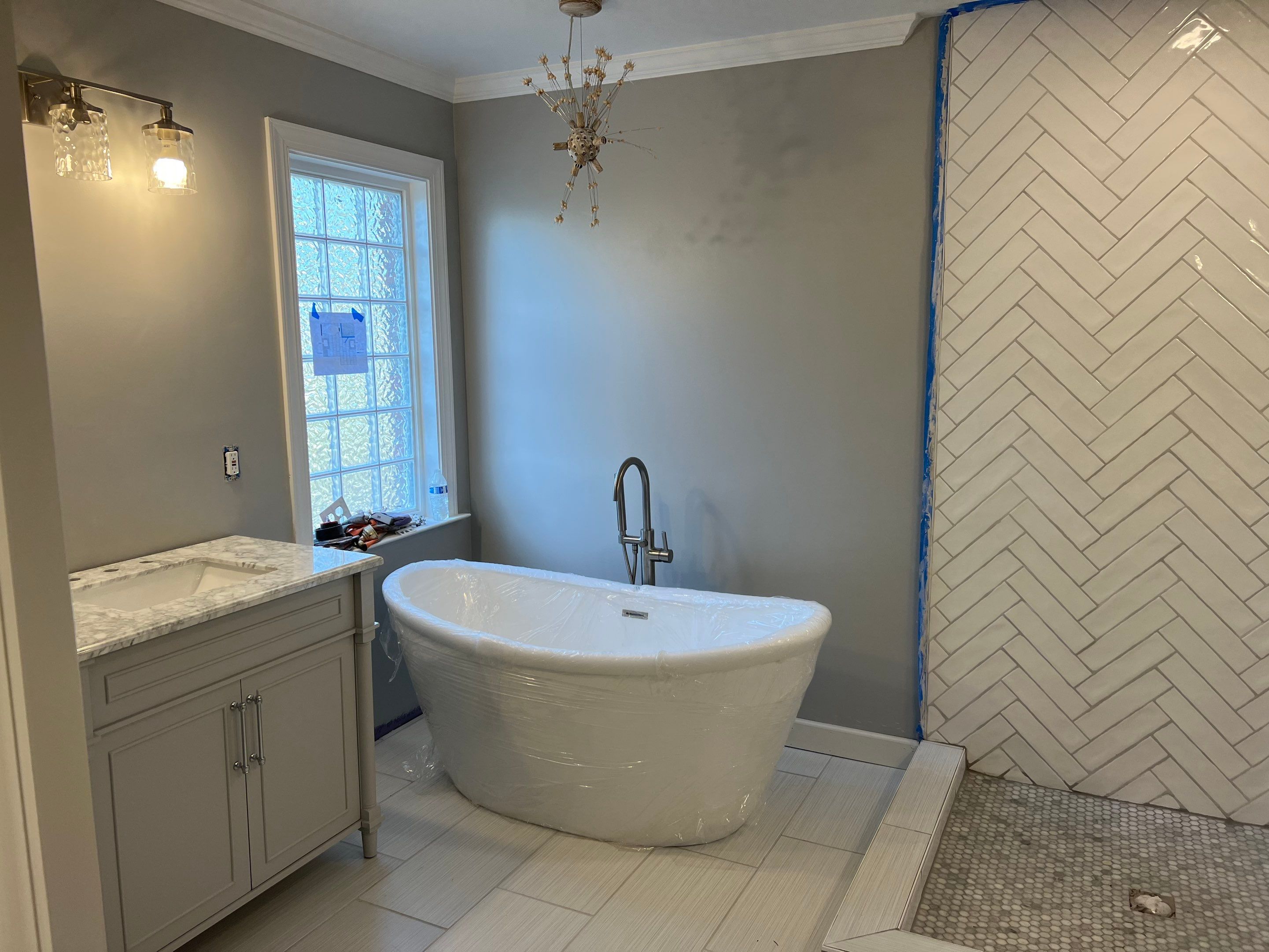 Bathroom Remodel using Schluter by Footprints Floors of Coastal Carolina