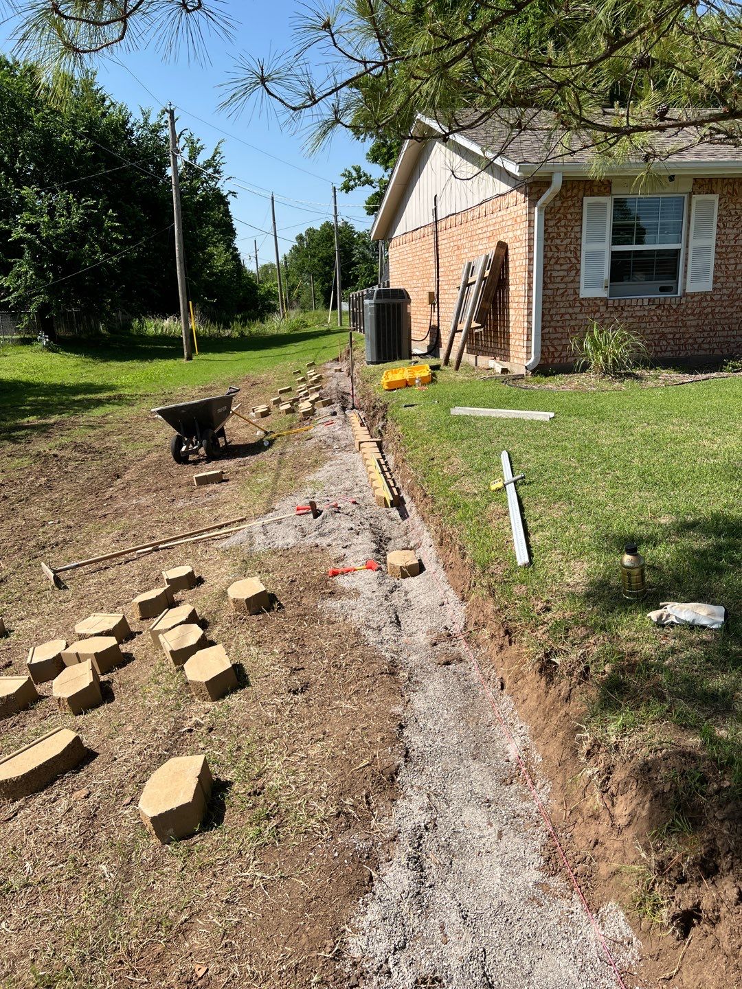 Retaining Wall using Rocks by Clays Services Inc