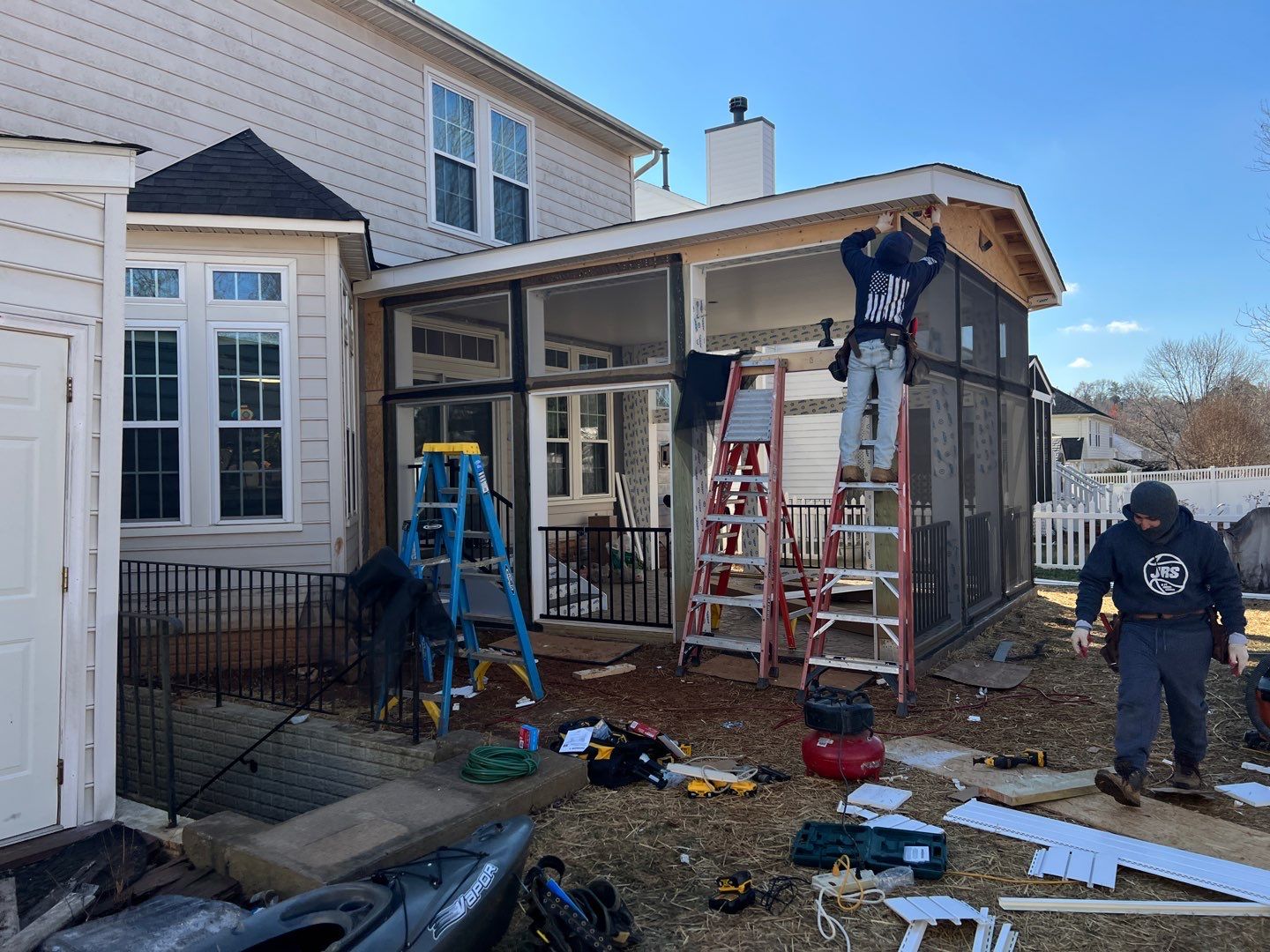 Custom Screened-In Porch with Stamped Concrete Patio in Warrenton by Jakari Restoration & Construction LLC