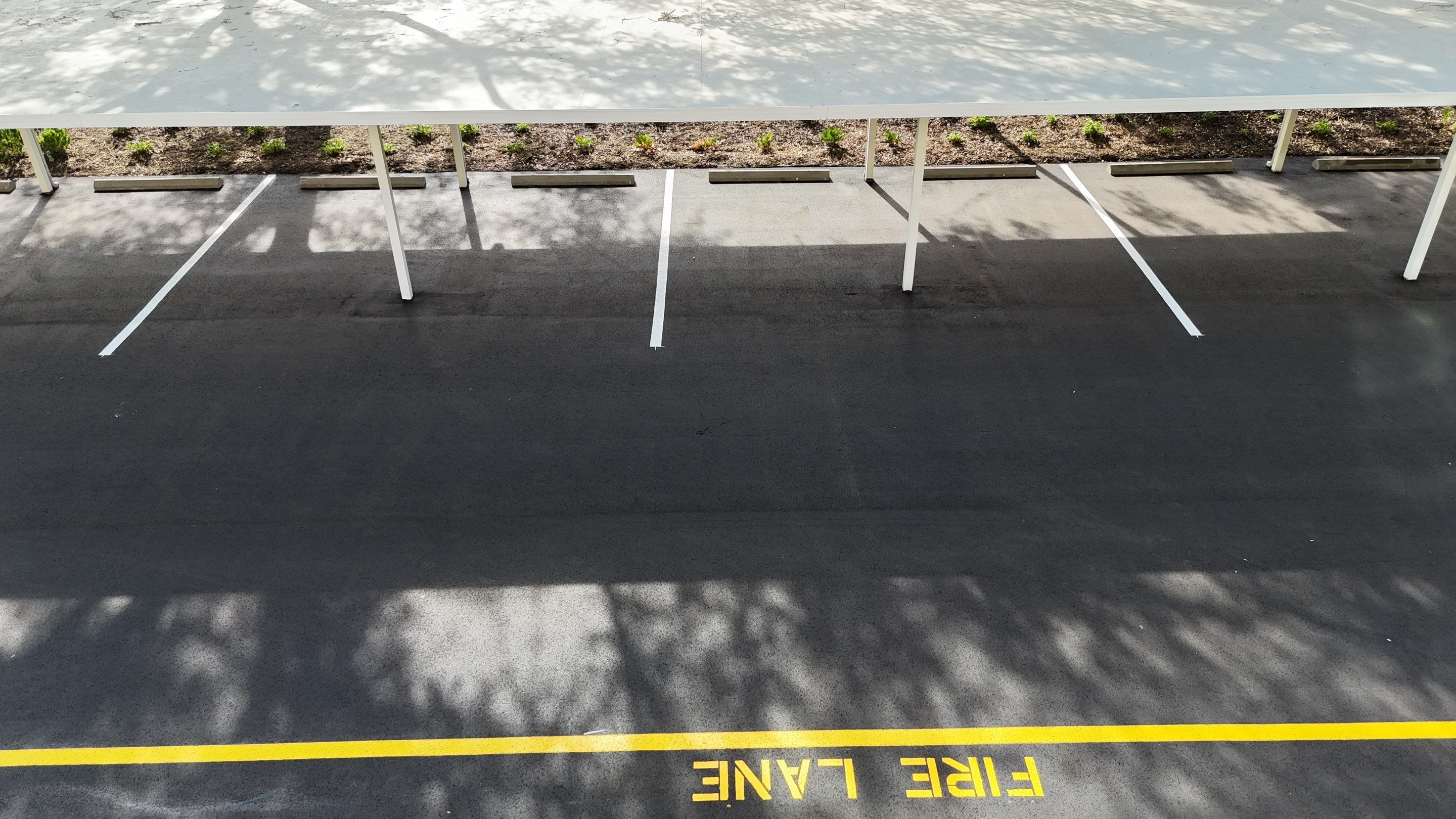 Comprehensive Parking Lot Mill and Overlay with Custom Line Striping in Venice by Everline Coatings & Services - Southwest FL