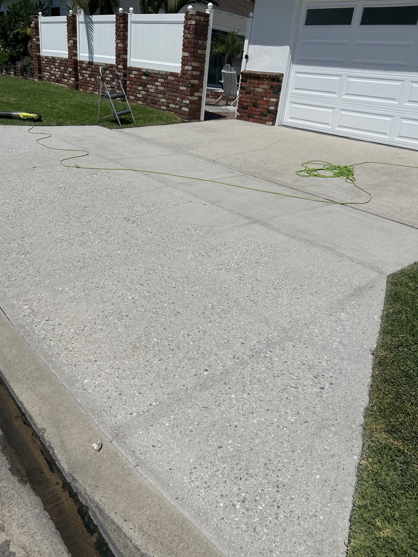 Sandblasting Paint Off Concrete Driveway In Downey, CA by La Power Washing Inc