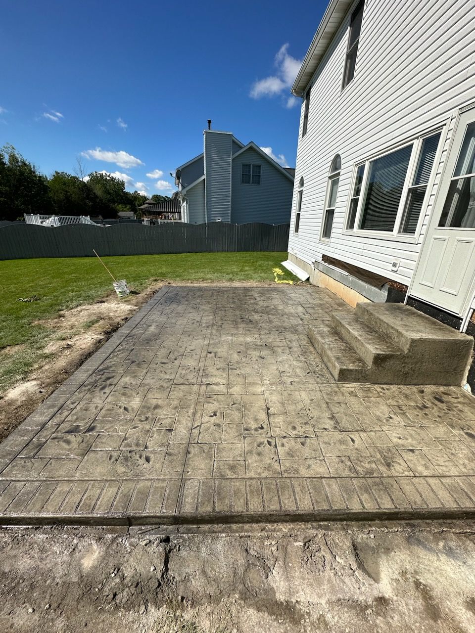 Stamped Concrete and Entry Door by Ivy Lea Construction