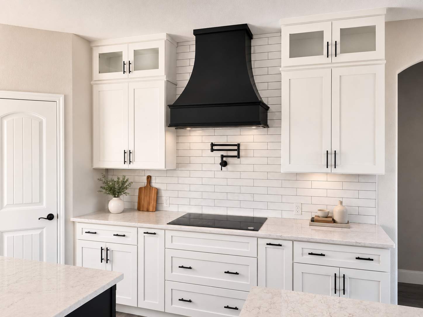 Modern White Kitchen Remodel in San Antonio Featuring Black Range Hood Before and After by Legacy Bath and Kitchen