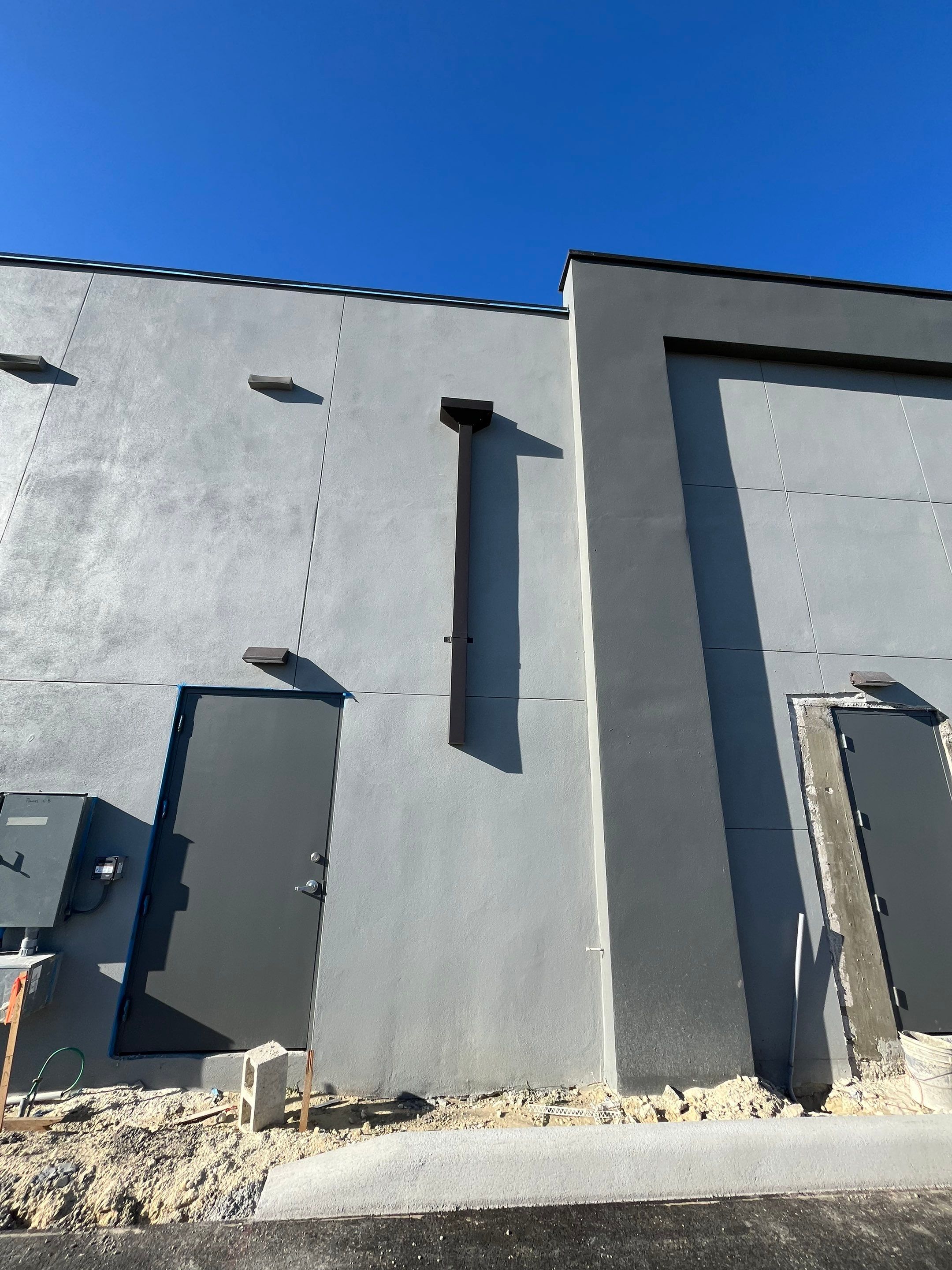 Downspout Installation using collector head in Cape Coral FL by Gutter Professors