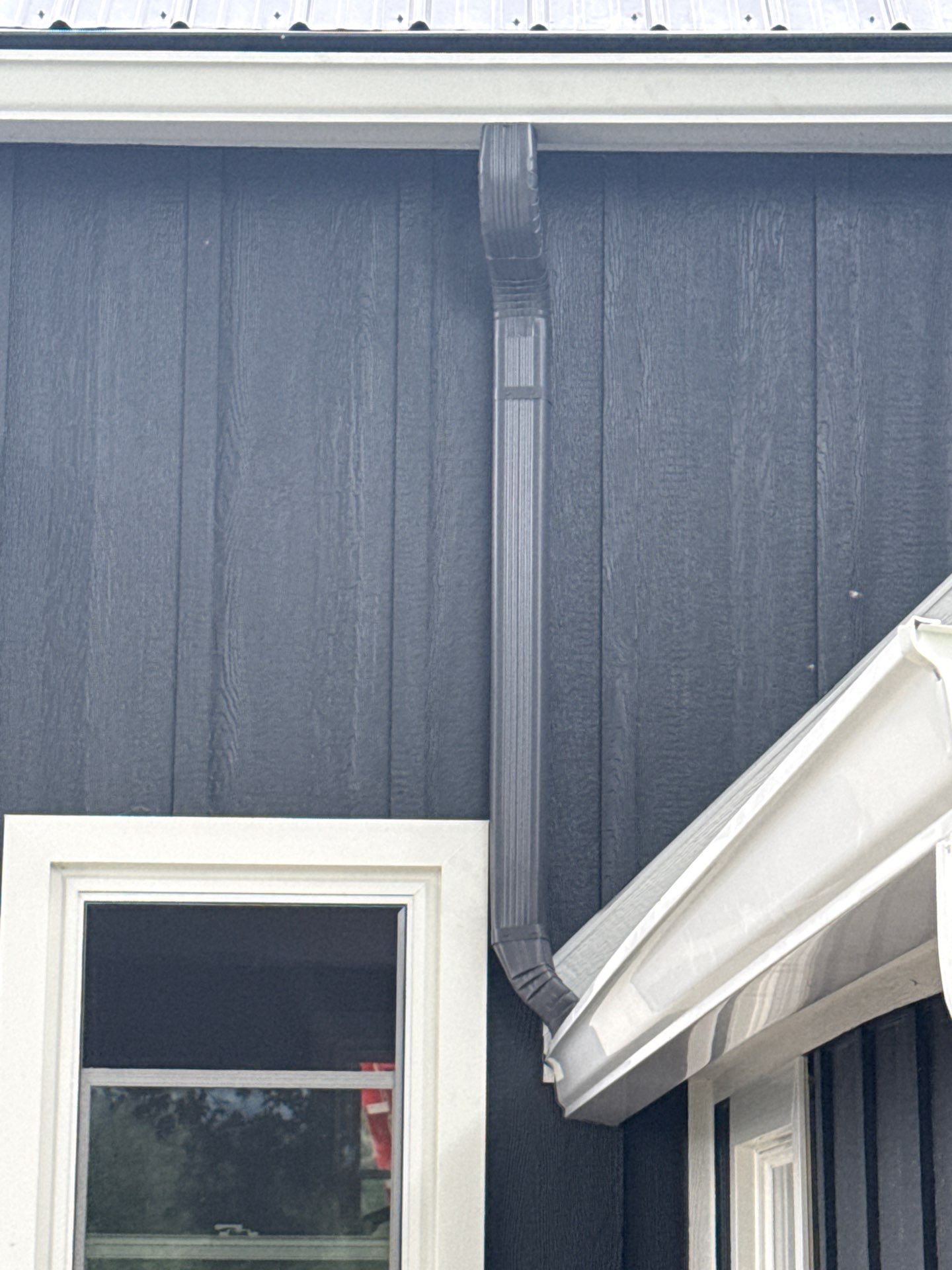 Seamless Gutter and Gutter Helmet Installation on Bellaire Metal Roof by Rainbow Seamless Systems