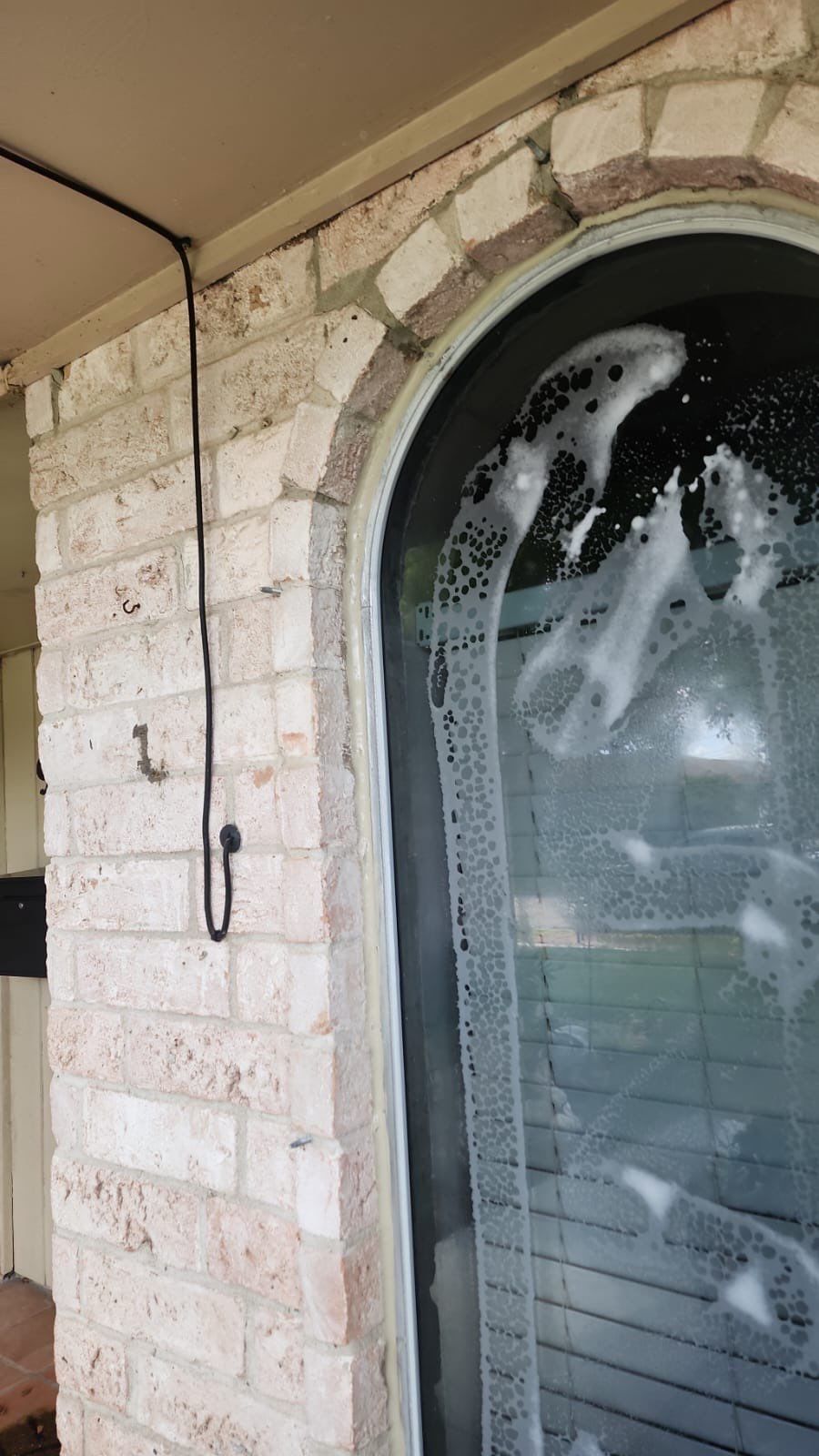 Colored Vinyl Windows to blend into brick by Bayfront Roofing and Construction