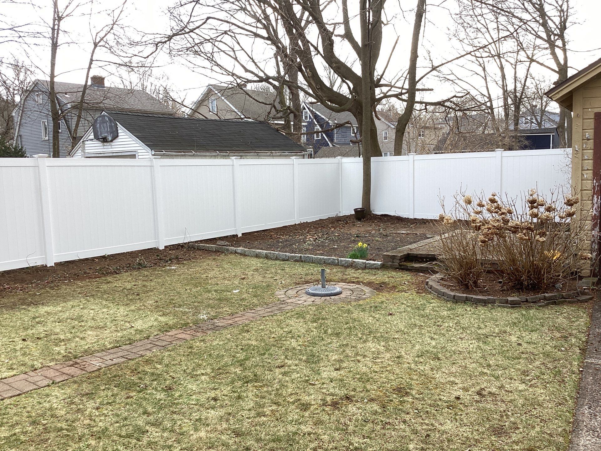 Fence replacement with White Vinyl privacy fence by DiGiorgi Roofing and Siding Inc