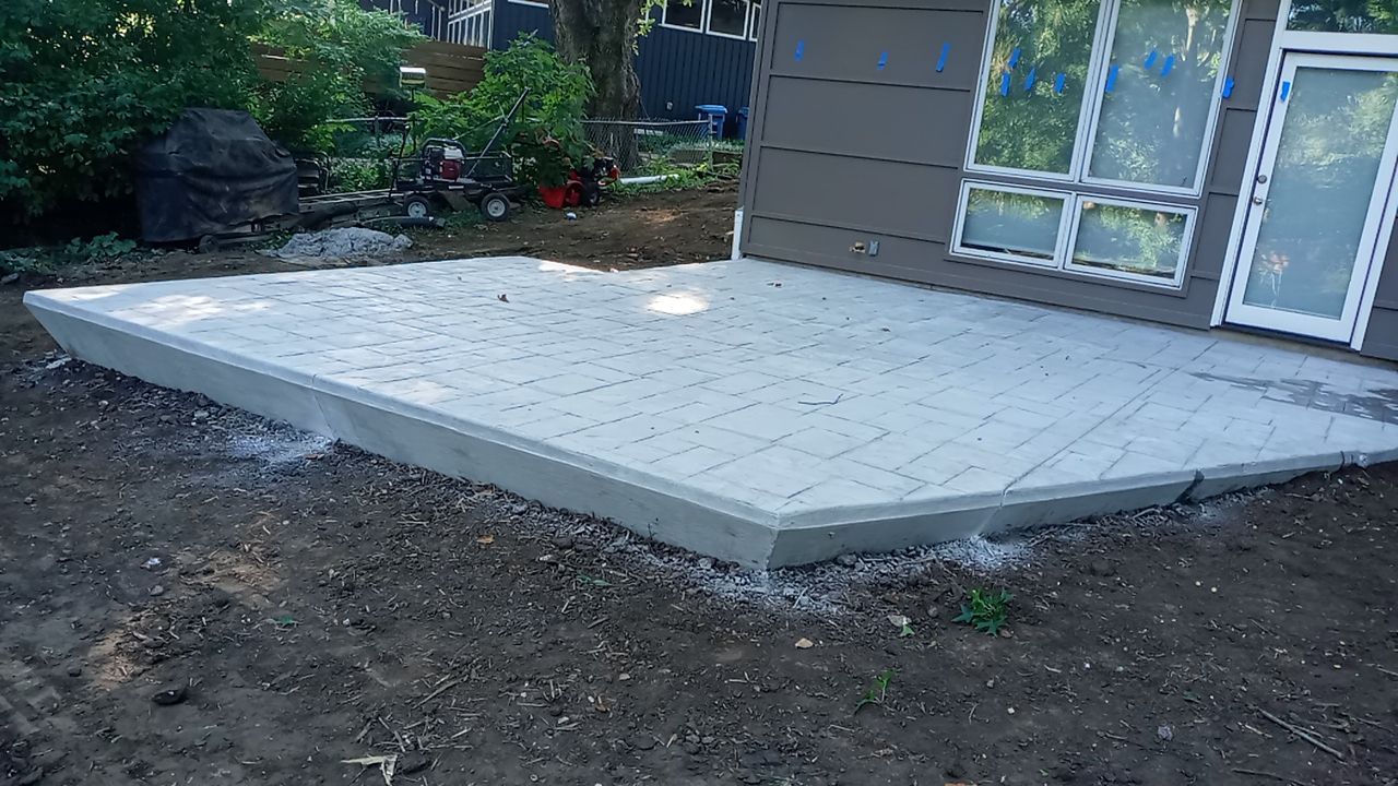Back Yard Cantilivered Patio by LAND ESCAPES LLC