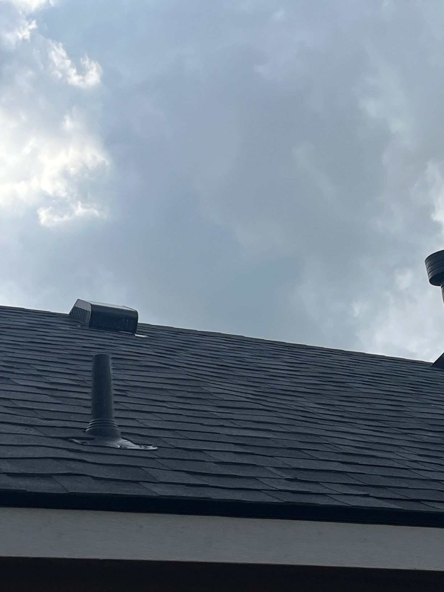 Red brick with Malarkey Midnight Black  by Tejas Roofworks + Restoration