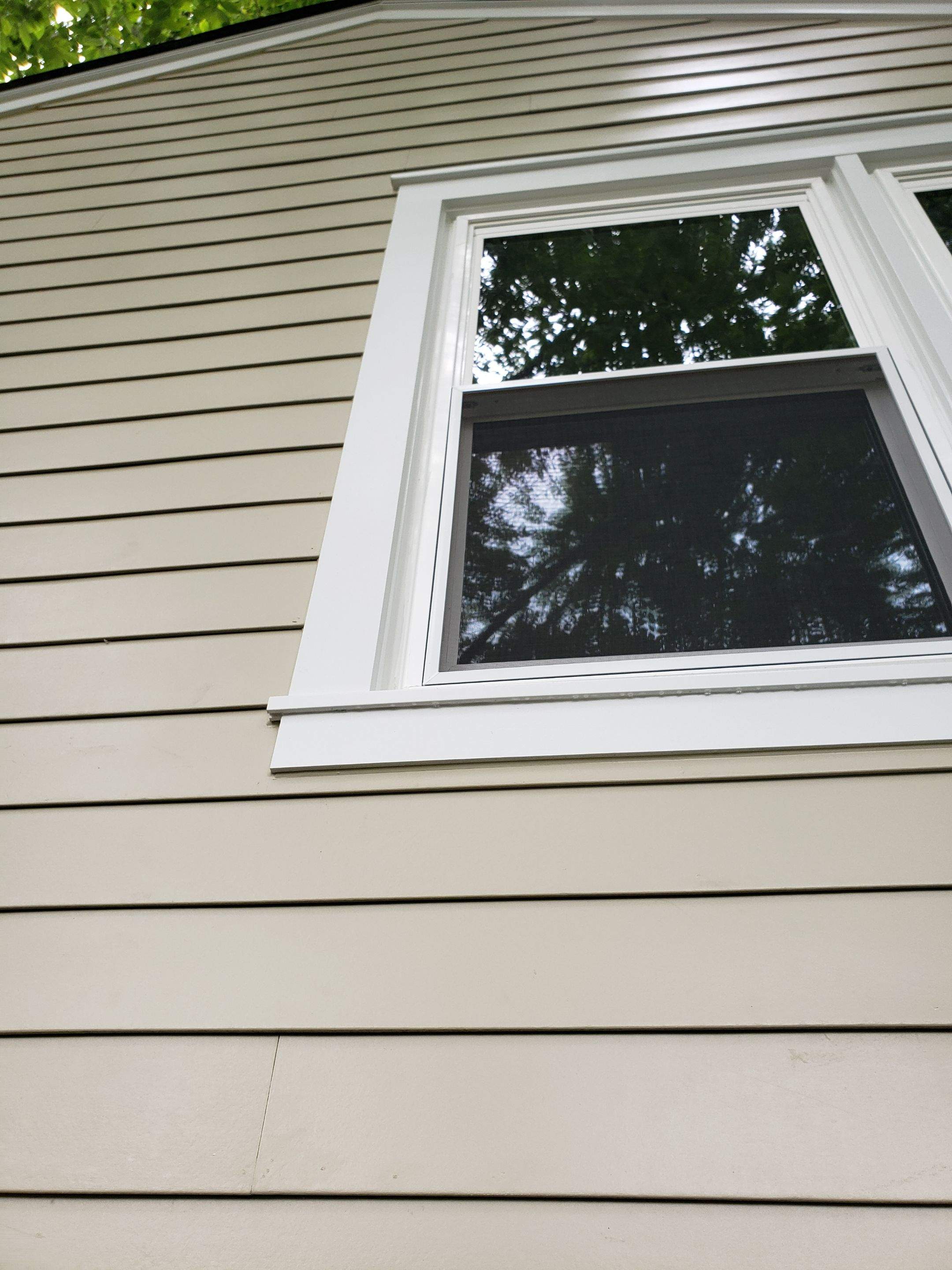New composite windows and fiber cement siding with trim and gutters by Window Depot of Annapolis