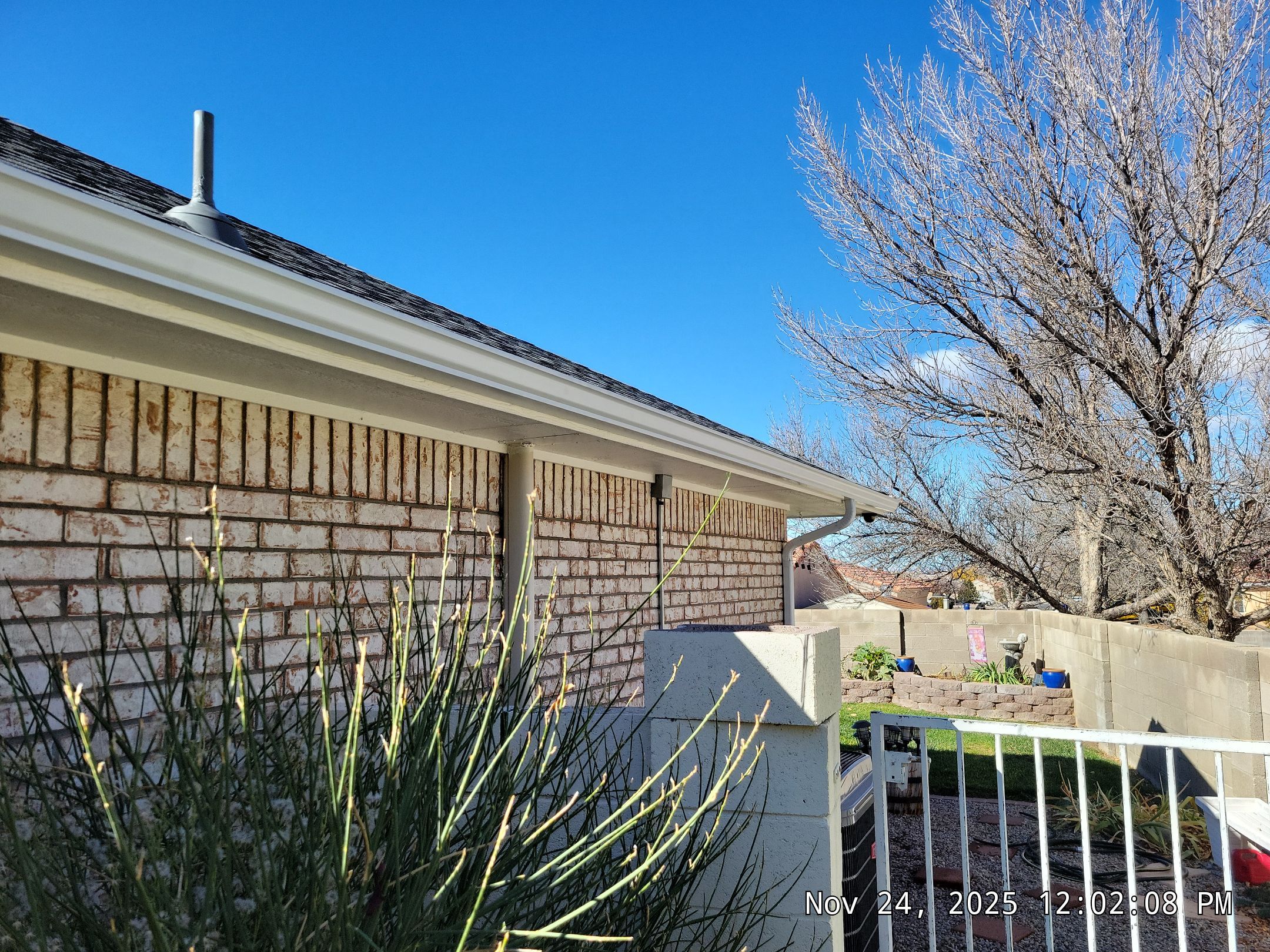 Seamless White Gutter and Downspout Installation in Albuquerque by Doyle Roof Masters Inc