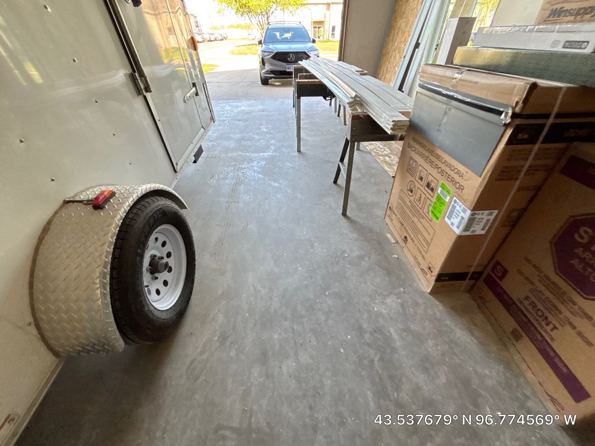 Coyote Flake Concrete Coating for Sioux Falls Garage by Select Painting, Coatings & Garage Cabinets