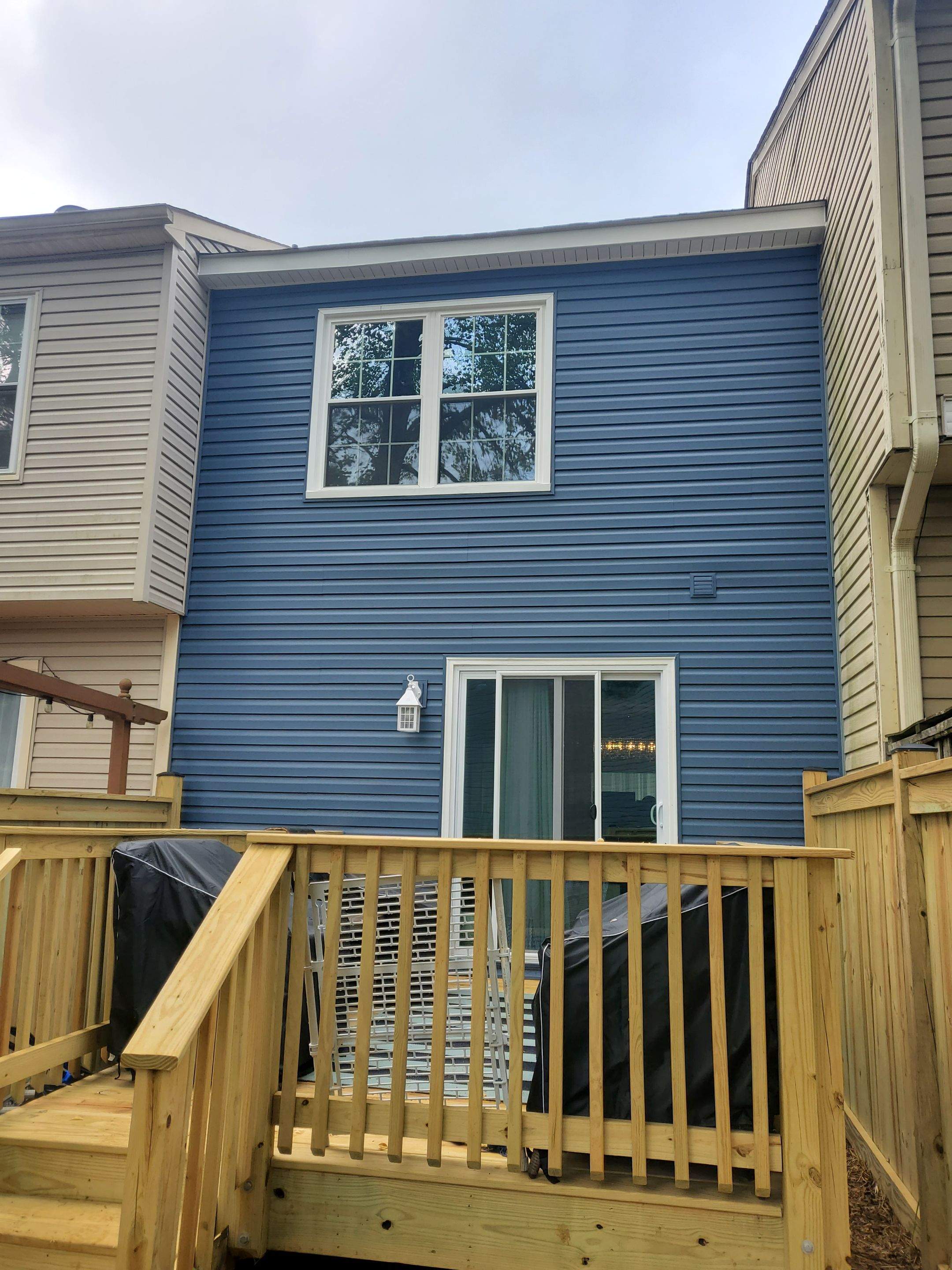Beautiful in Blue - Mastic Siding Replacement by American Home Contractors