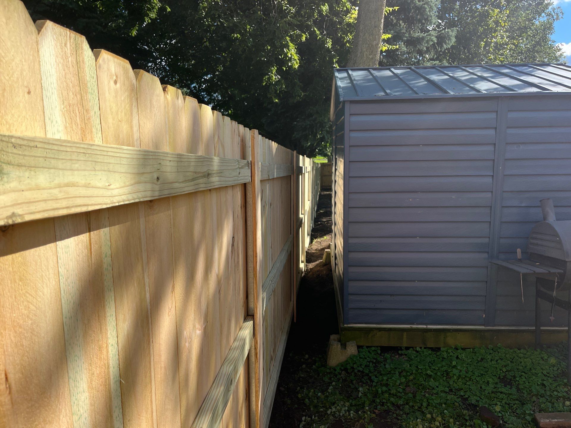 Pressure-Treated Wood Privacy Fence Installation in Waverly, Iowa by Perfect Picket Fence and Stain
