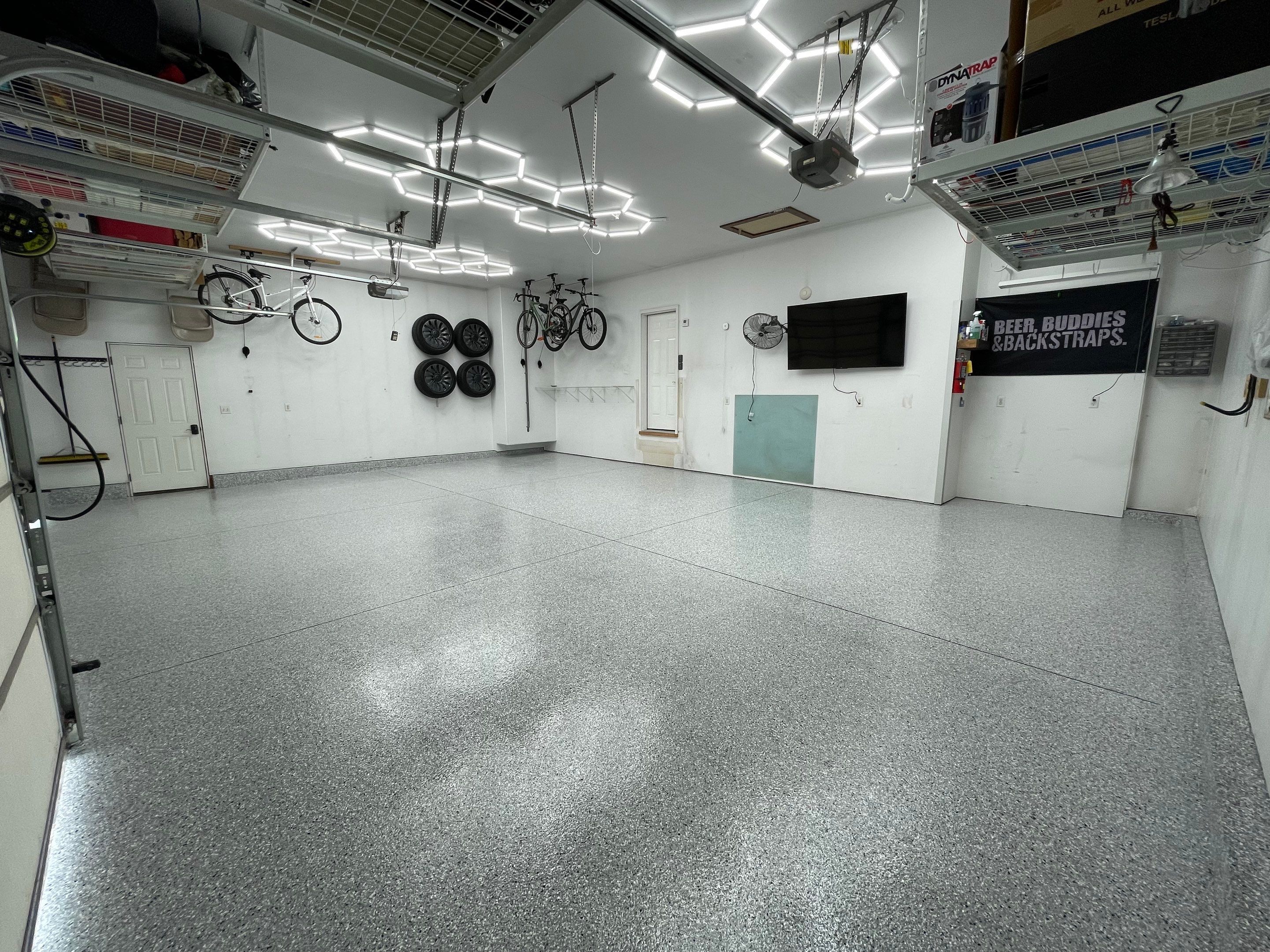 Feather Gray Epoxy Floor Coating Installation in Sioux Falls by Select Painting, Coatings & Garage Cabinets