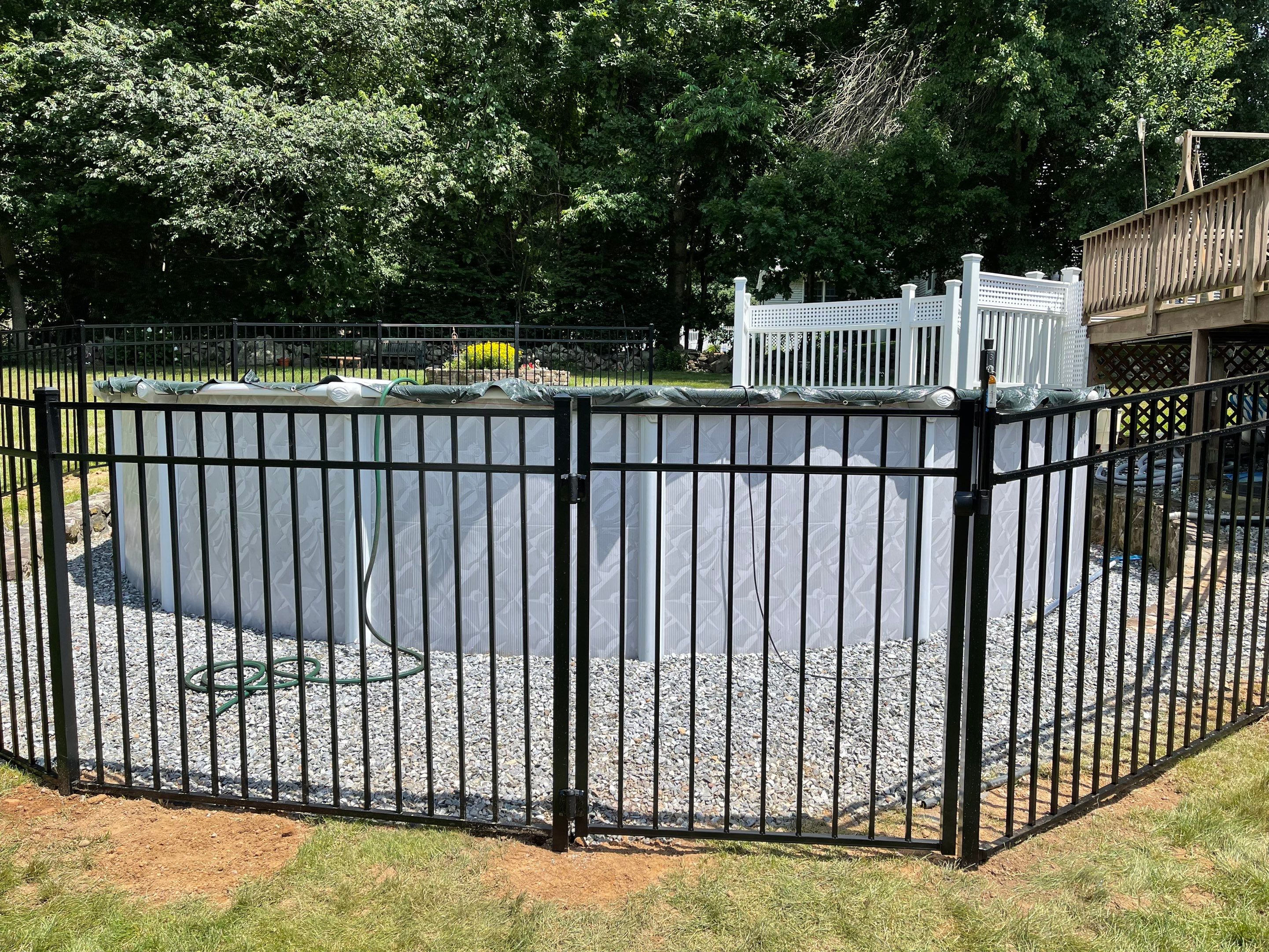 New Aluminum pool fence with matching gate and pool latch by DiGiorgi Roofing and Siding Inc