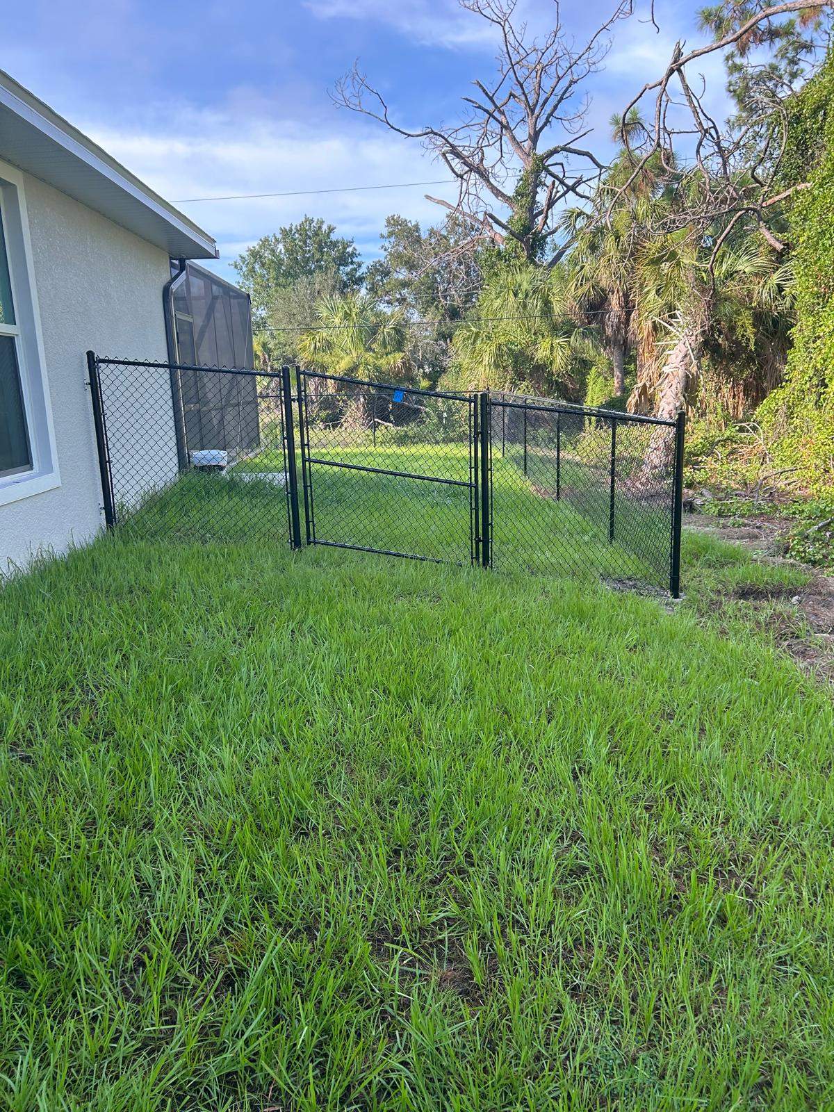 Residential Black Vinyl-Coated Chain Link Fence in Port Charlotte by True Fence LLC