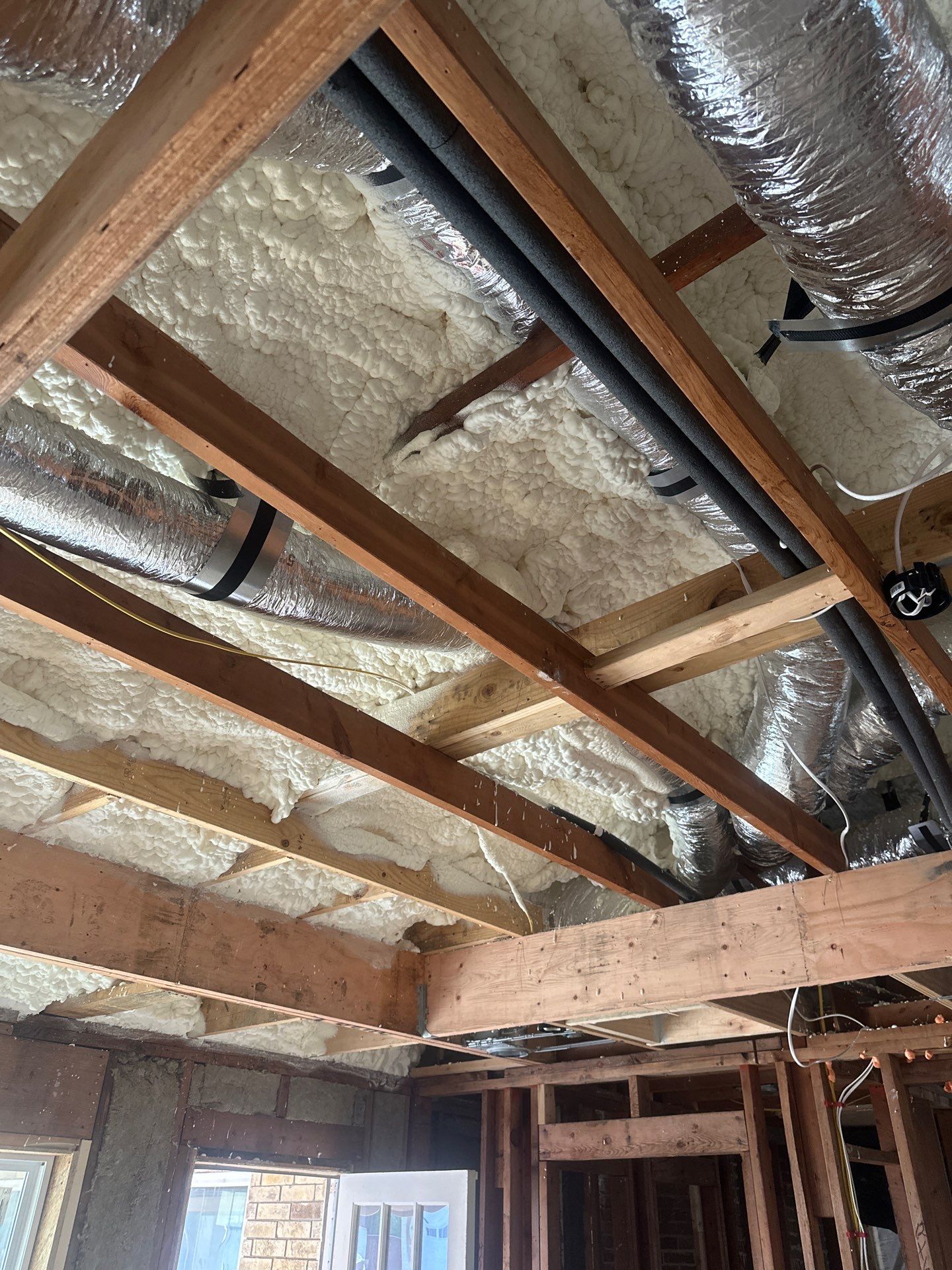 Open cell spray foam & rockwool job completed in Dallas TX by Apex Insulation Solutions