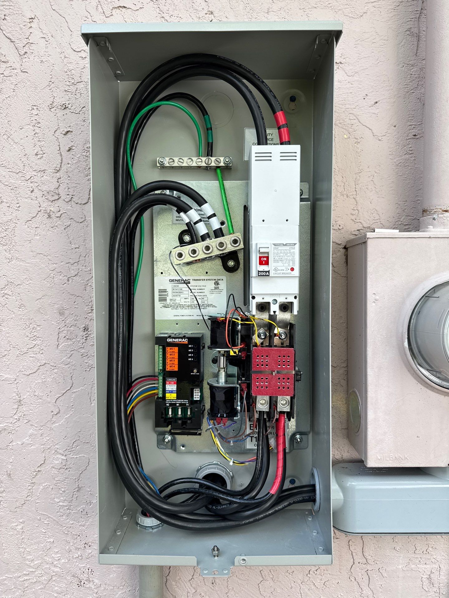 Installation of a 26 kw Generac Whole-Home Standby Generator and 200Amp Automatic Transfer Switch by Smartron Electric