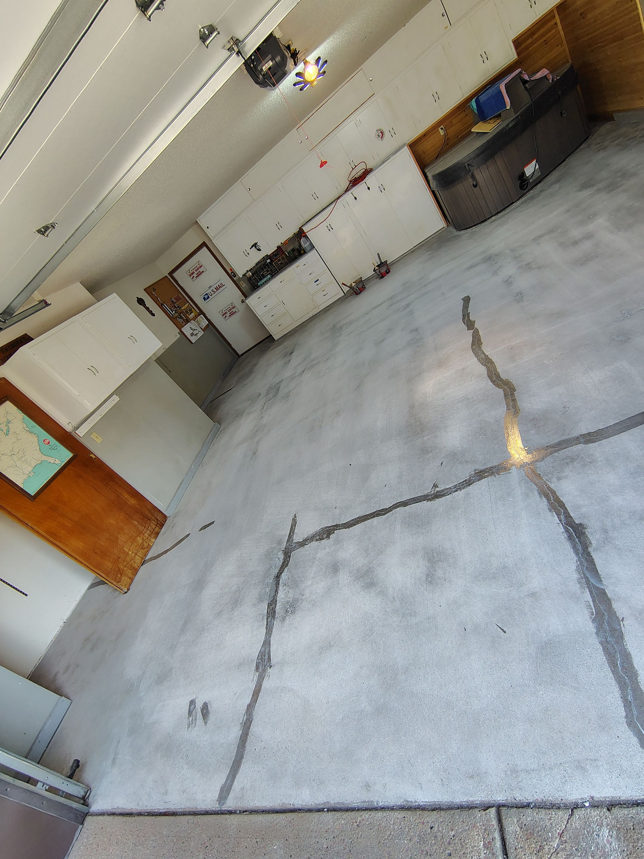 Domino Flake Garage Floor Coating Installation in Sioux Falls by Select Painting, Coatings & Garage Cabinets