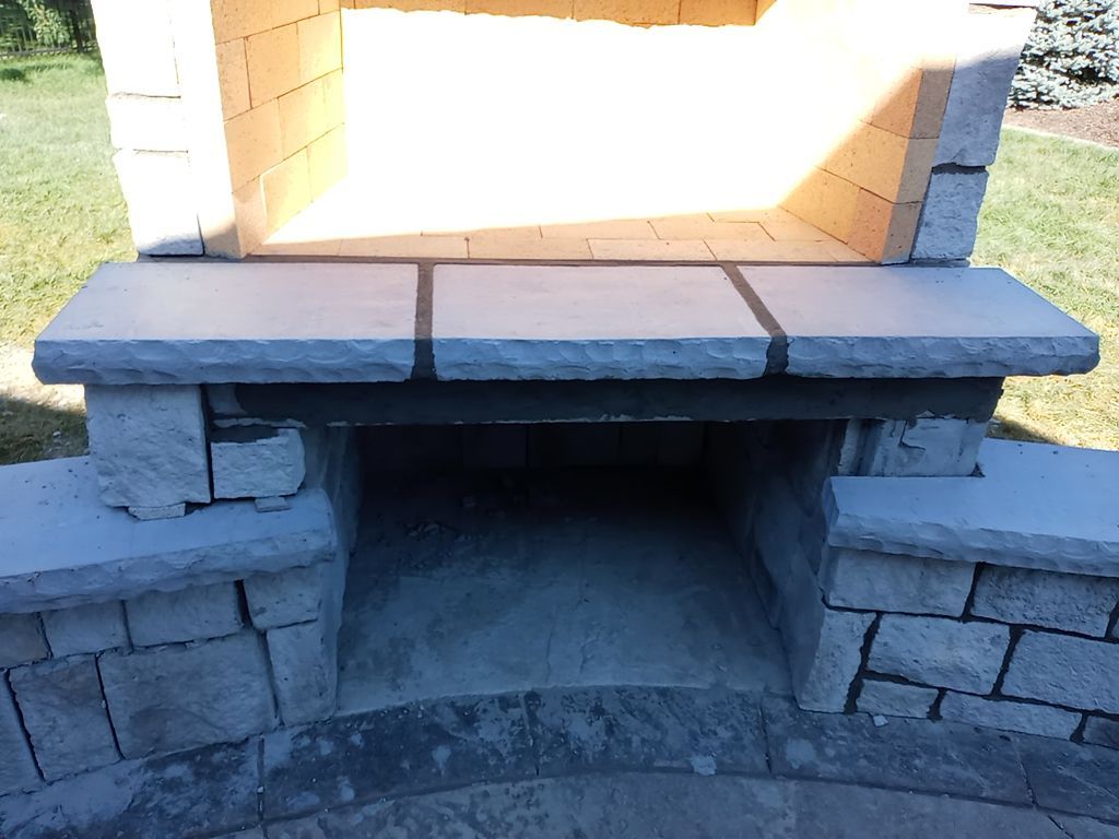 Back Yard Fireplace and Landscape by LAND ESCAPES LLC