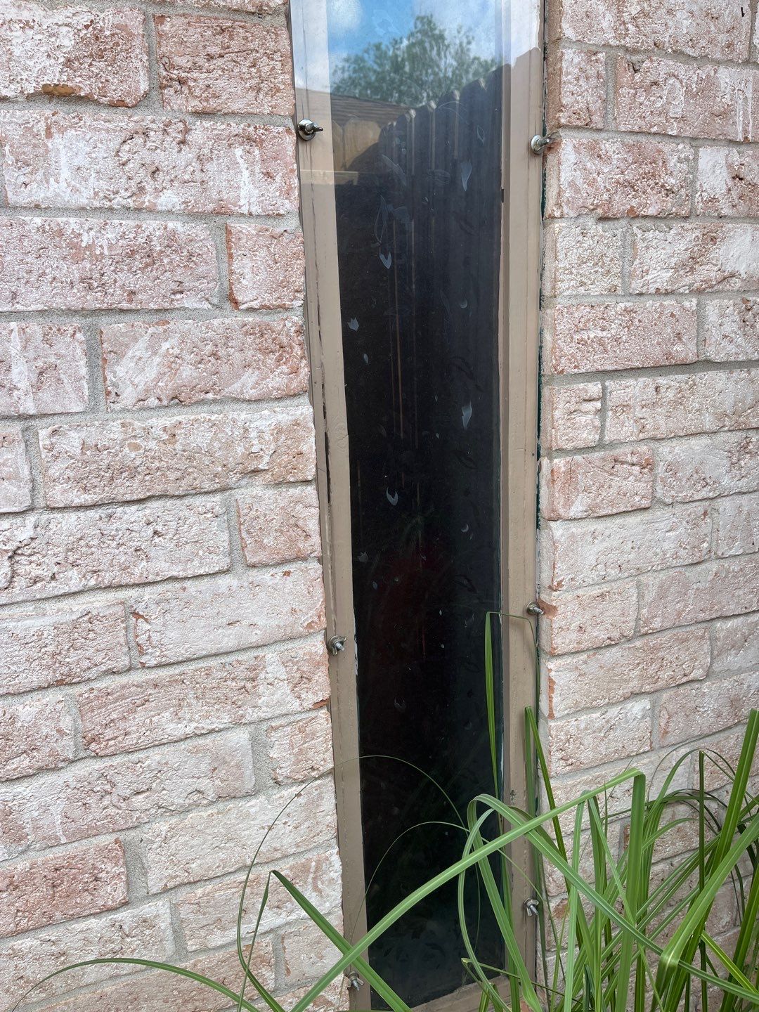 Colored Vinyl Windows to blend into brick by Bayfront Roofing and Construction