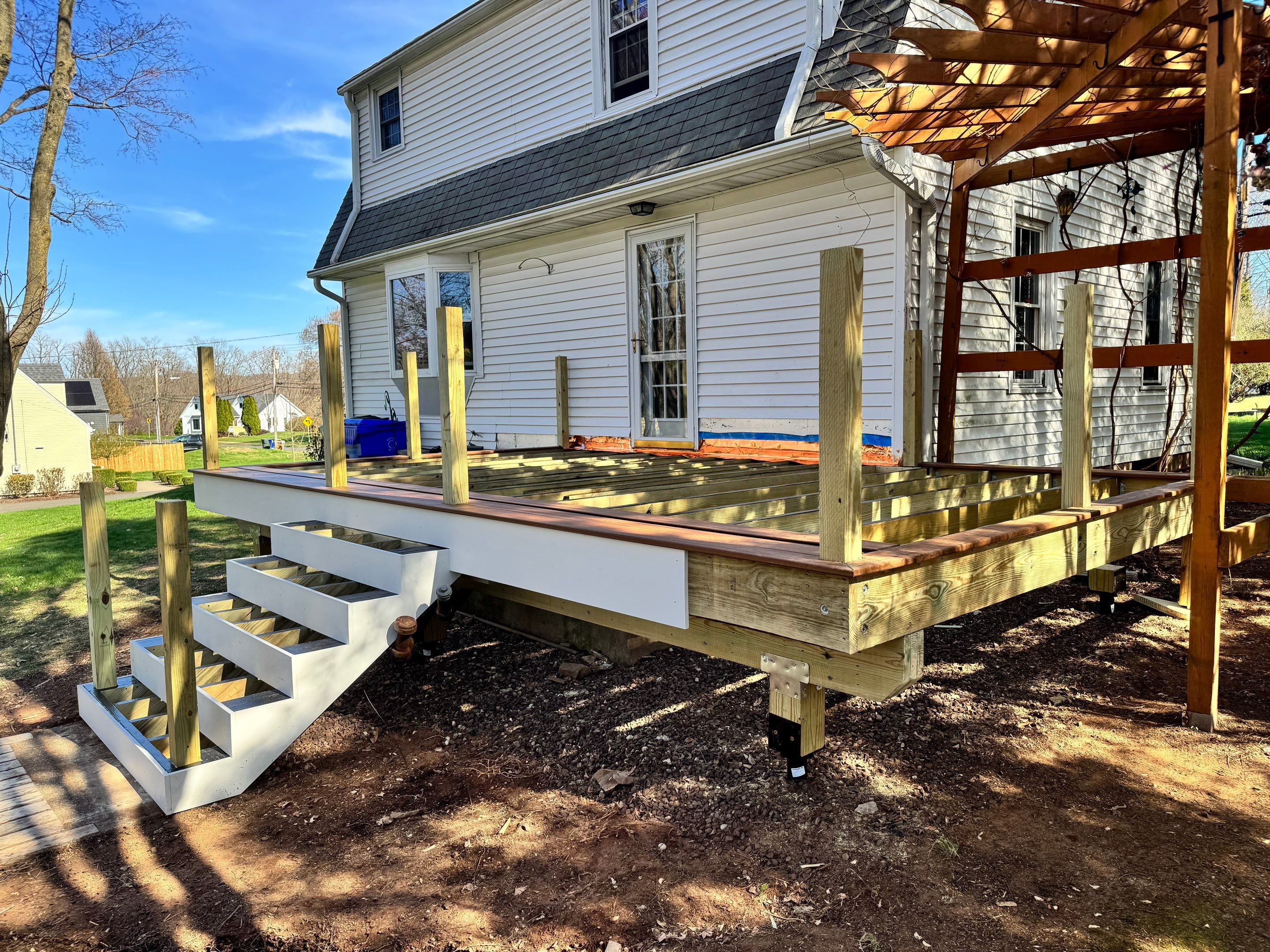 Replacement deck with Trex Transcend Tiki Torch deck boards and matching cocktail rail. by DiGiorgi Roofing and Siding Inc