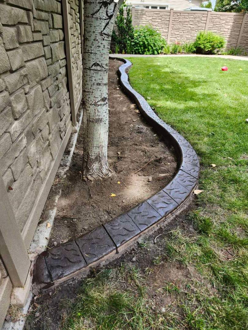 Decorative Stamped Concrete Landscape Edging Installation in Medicine Hat by Pump it Up Concrete Jacking