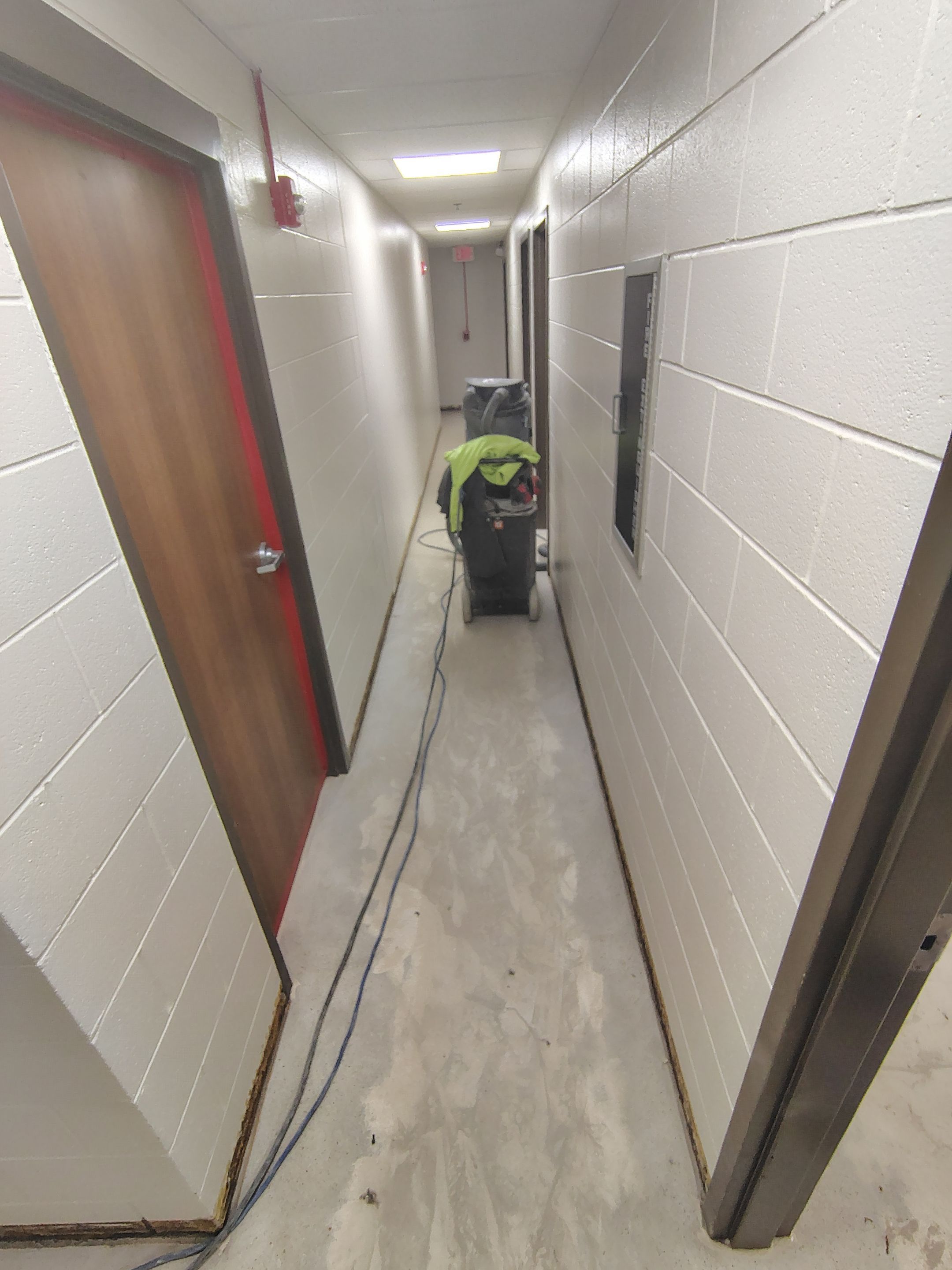 Industrial Flake Epoxy Floor Installation at Pierre National Guard Facility by Select Painting, Coatings & Garage Cabinets