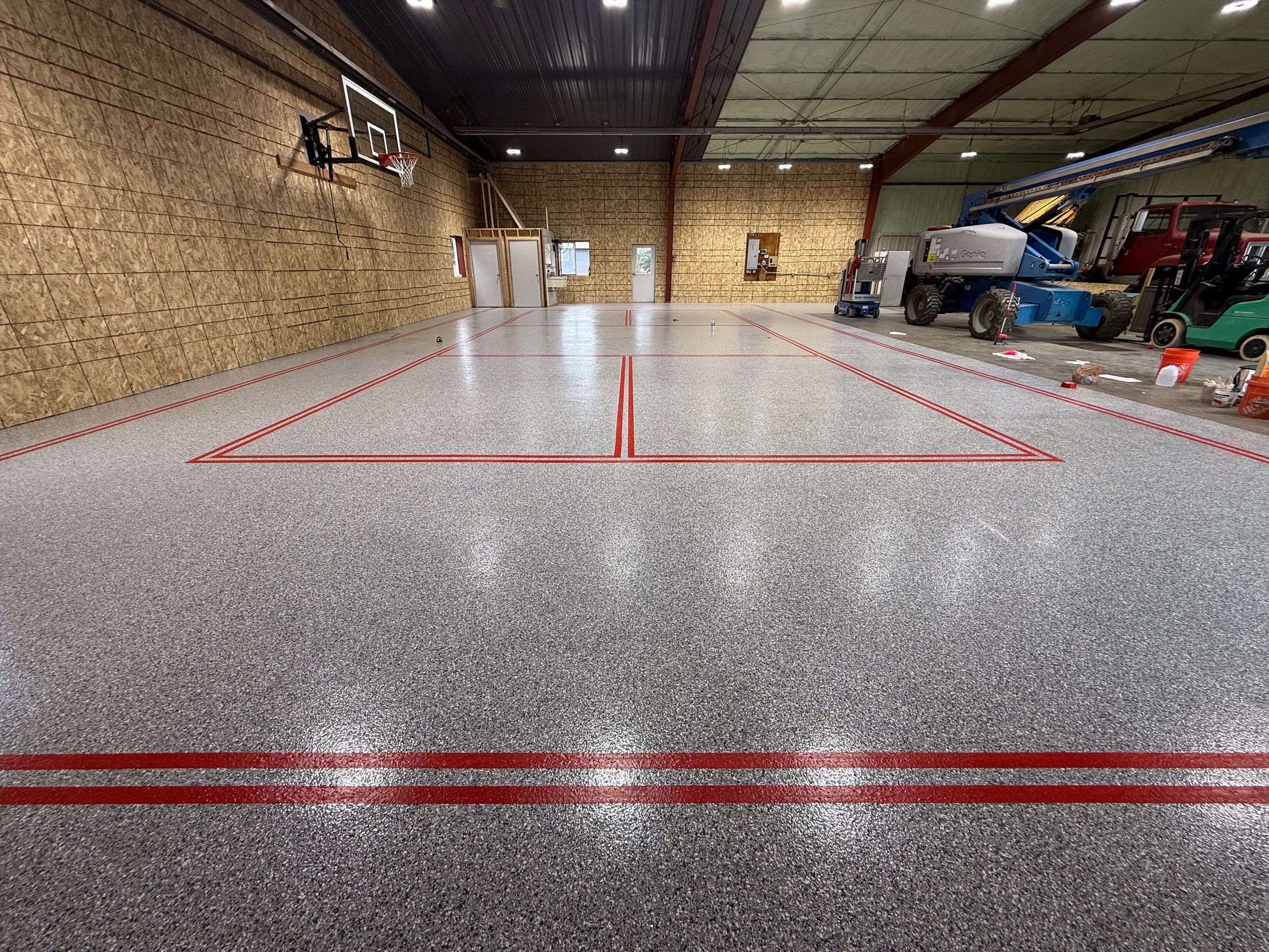 Custom Polyurea Shop Floor with Basketball Court Lines in Rock Valley by Select Painting, Coatings & Garage Cabinets