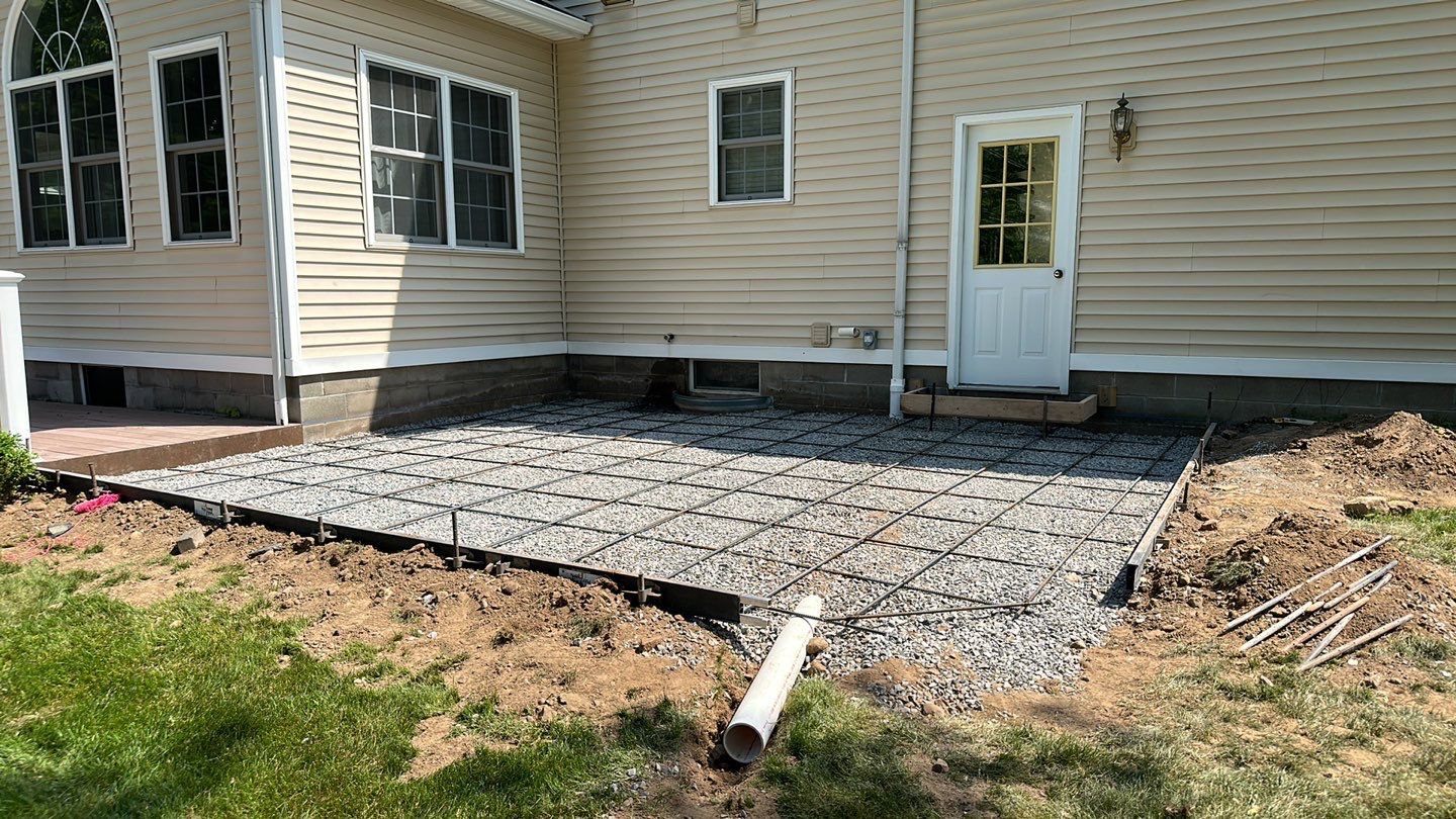 Broom finished concrete patio  by NG Masonry & Construction LLC
