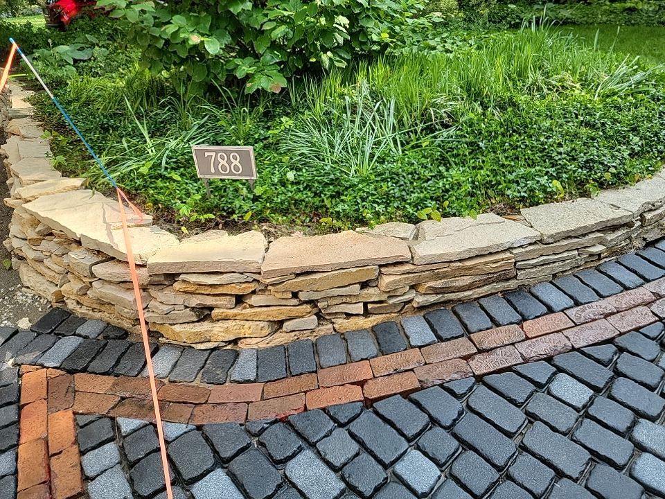 Glencoe, IL brick paver clean sand seal, repair, and reseal by Northern Power Washing LLC.