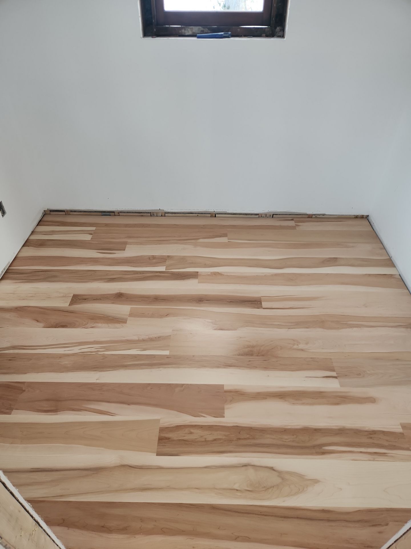 Full glue down Installation over radiant heat 7" Maple character grade by Ann Arbor Hardwoods 