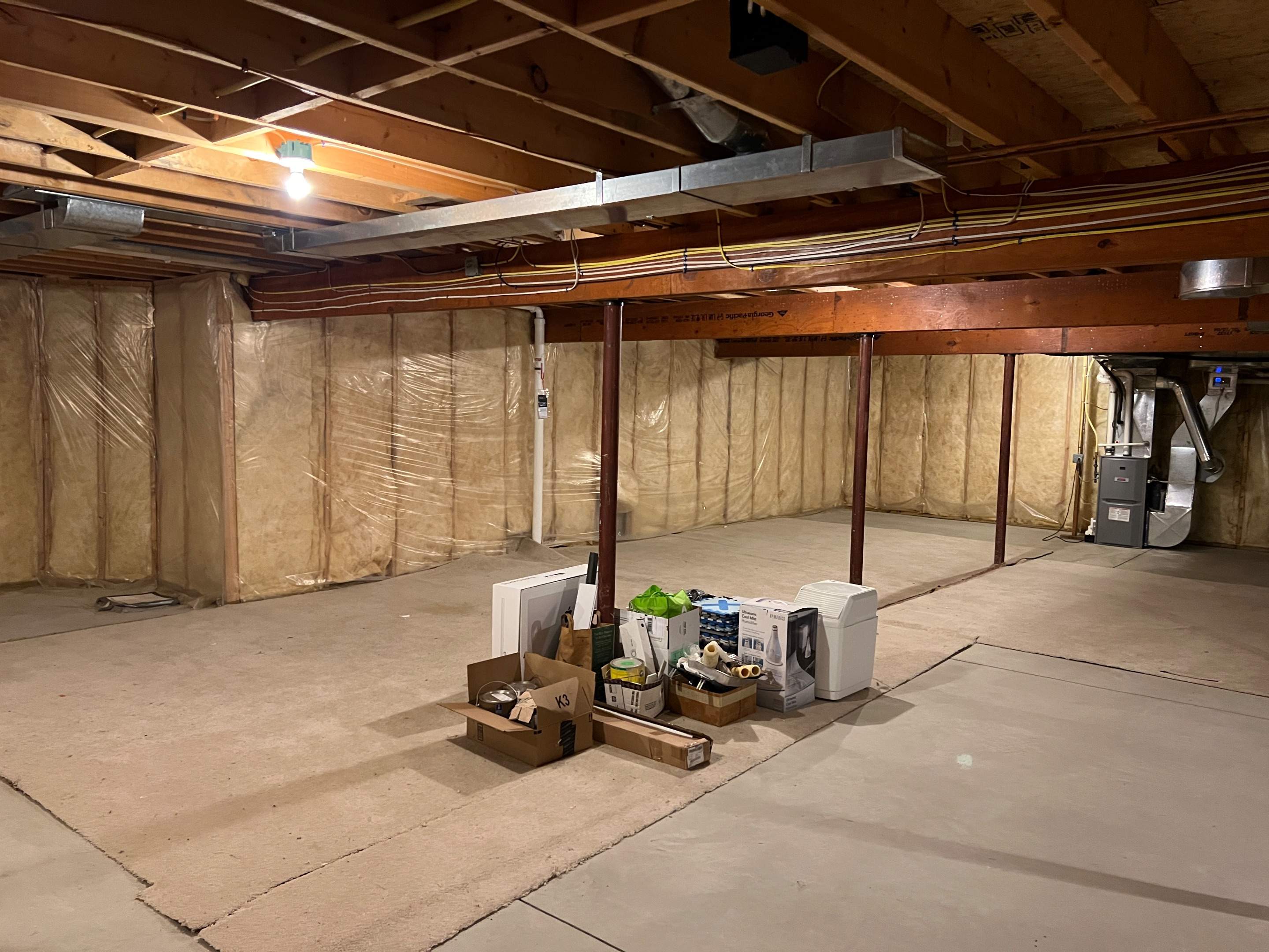 Basement Remodel w/ LVP Flooring & Exposed Ceiling by Chagnon Building & Remodeling LLC