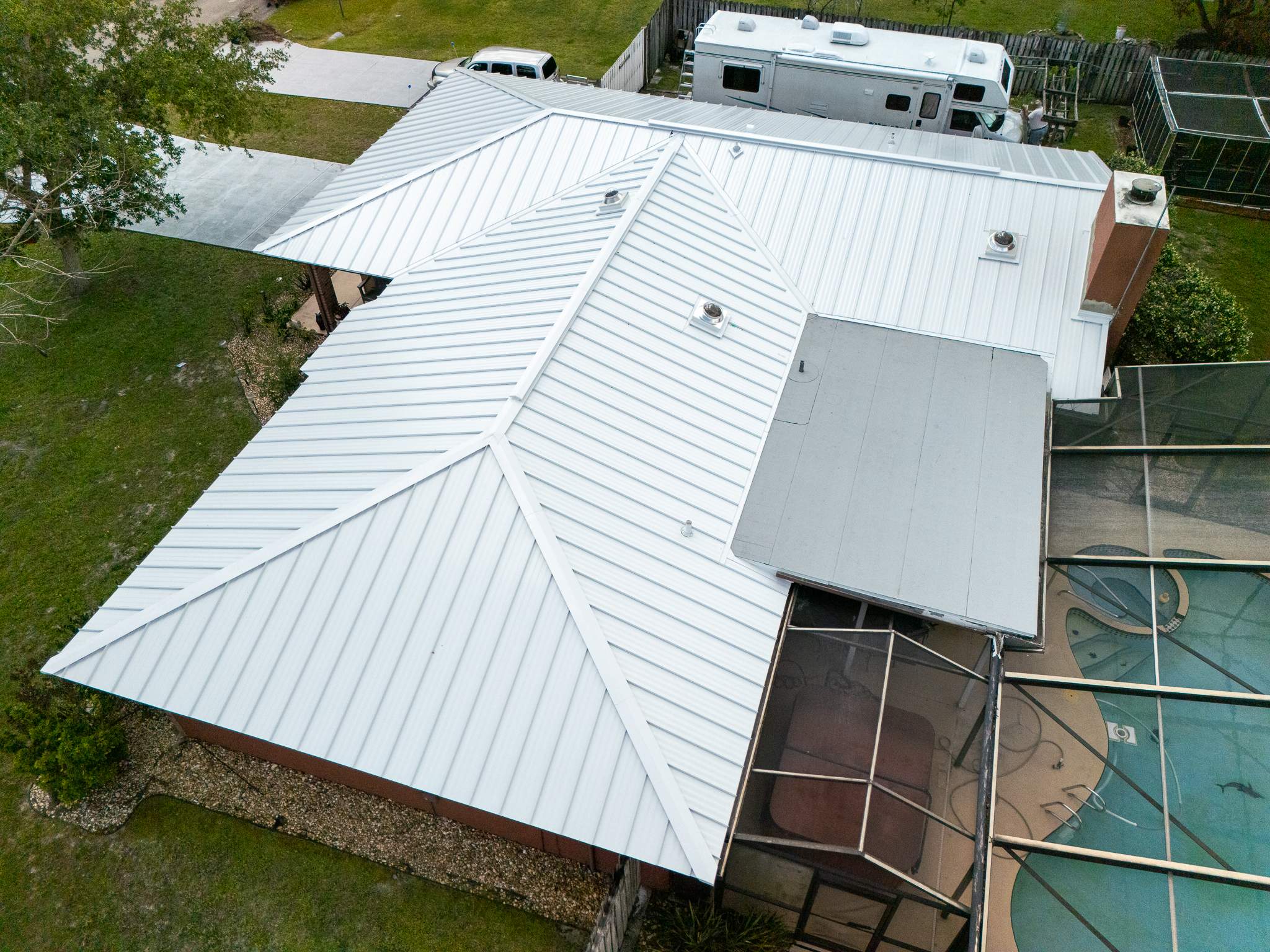 White Standing Seam Metal Roof Replacement and Hurricane Reinforcement in Palm Bay, Florida by Wiedmann Construction & Roofing