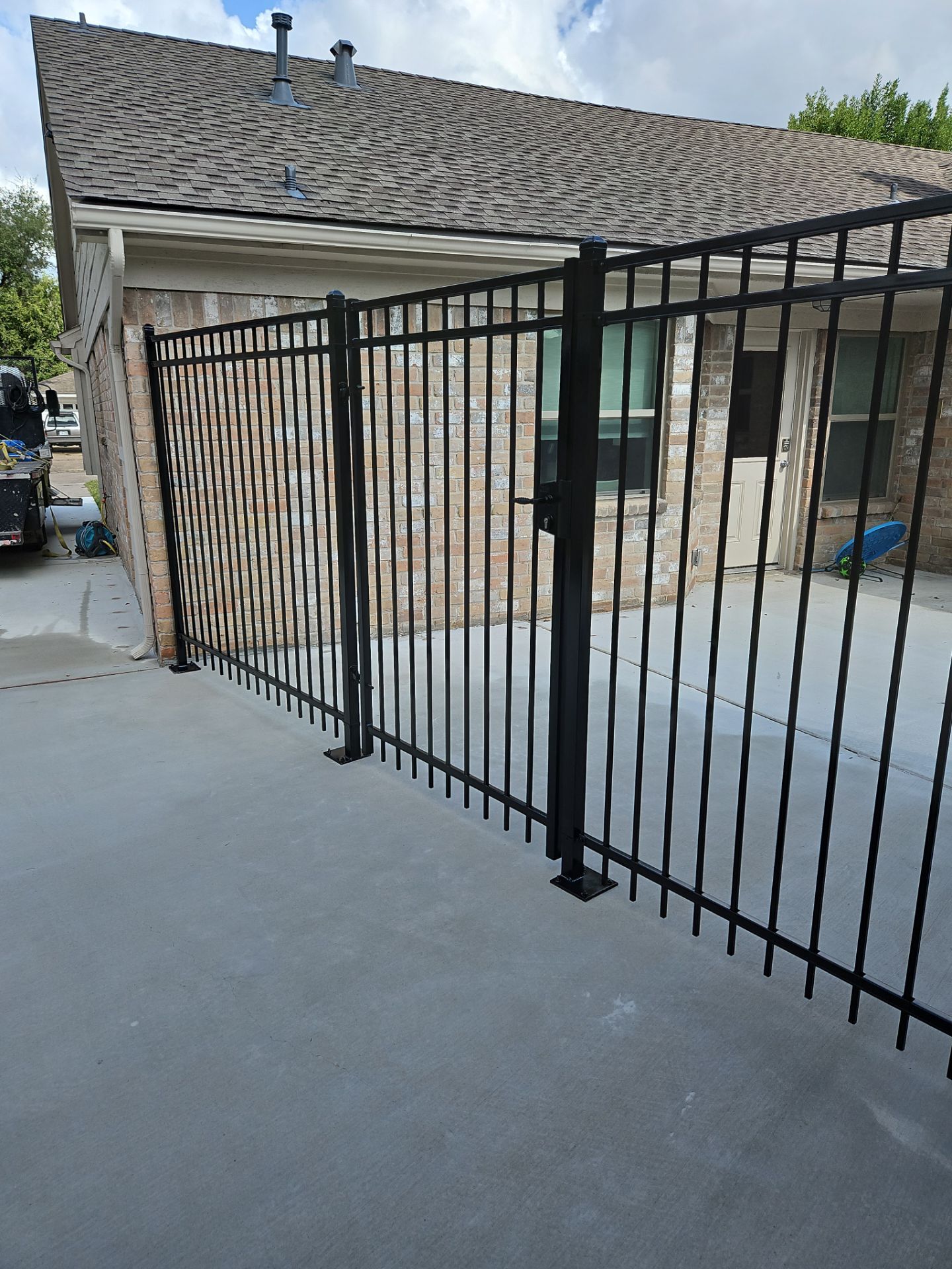 Iron fence installation using 6ft - 3 Rail - Ameristar Montage by Tim's Fences