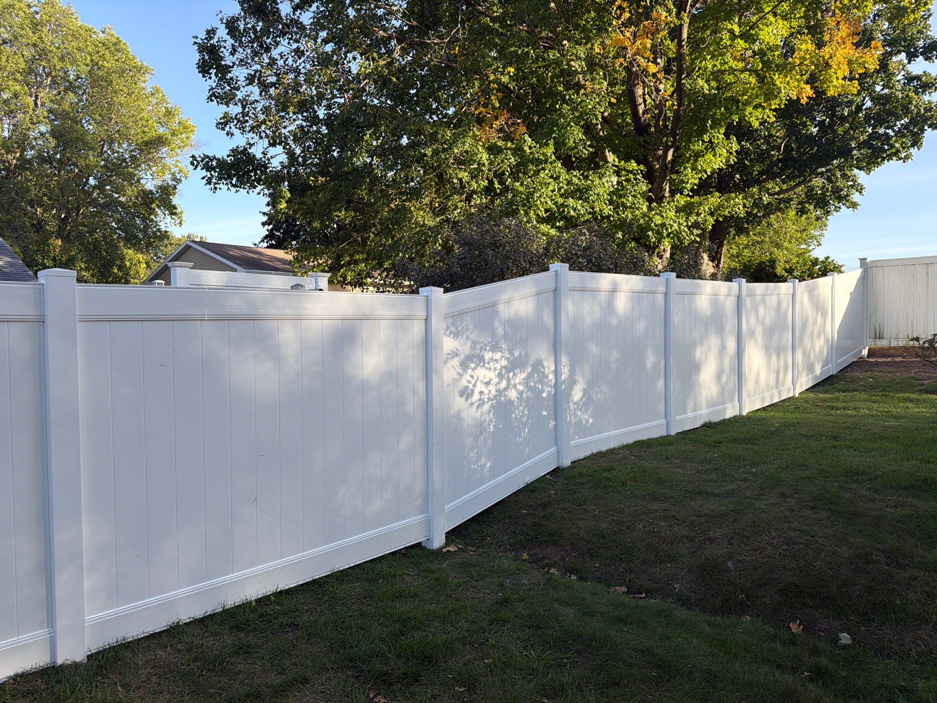 White Vinyl Privacy Fence and Gate Installation in Grundy Center by Perfect Picket Fence and Stain