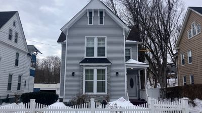 Siding & Stone Transformation with Cert. Monogram D/4 x 12'6" clapboard, Sterling Gray & Stone Facade, Glacier Bay