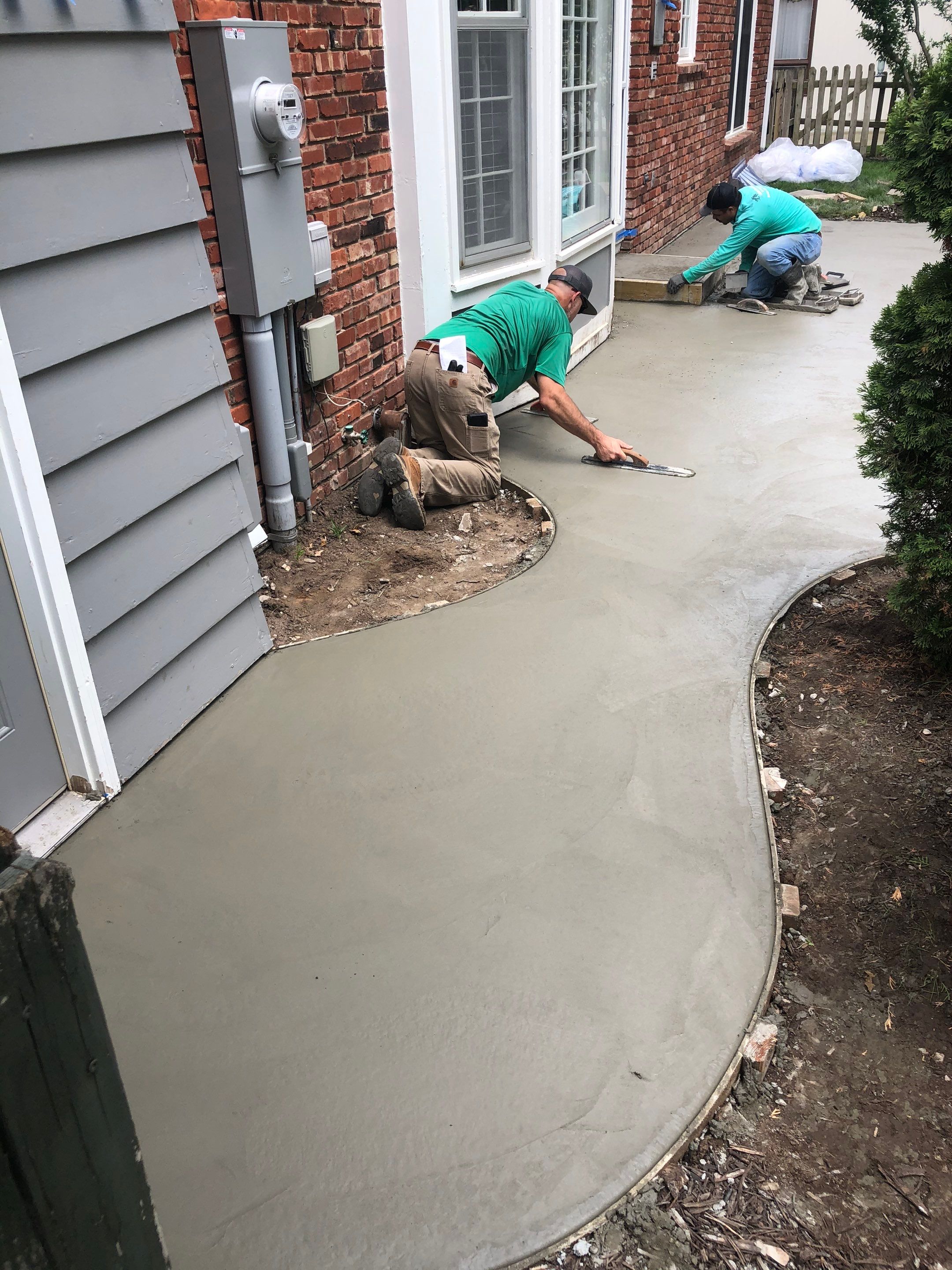 Back Yard Stamped Patio by LAND ESCAPES LLC