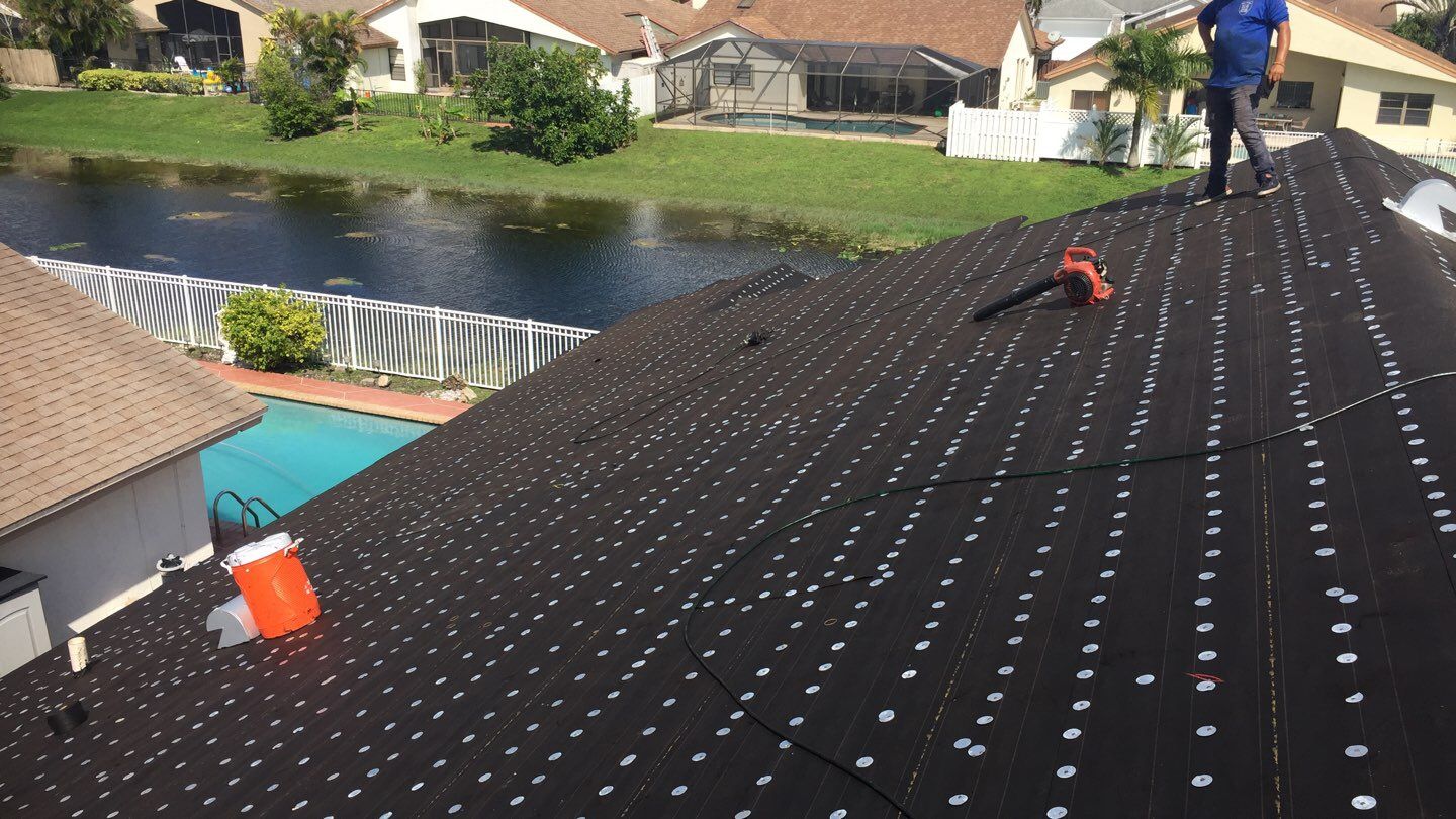 Residential Roofing Installation using 1" Nail strip metal roof by BLUES BROTHERS ROOFING