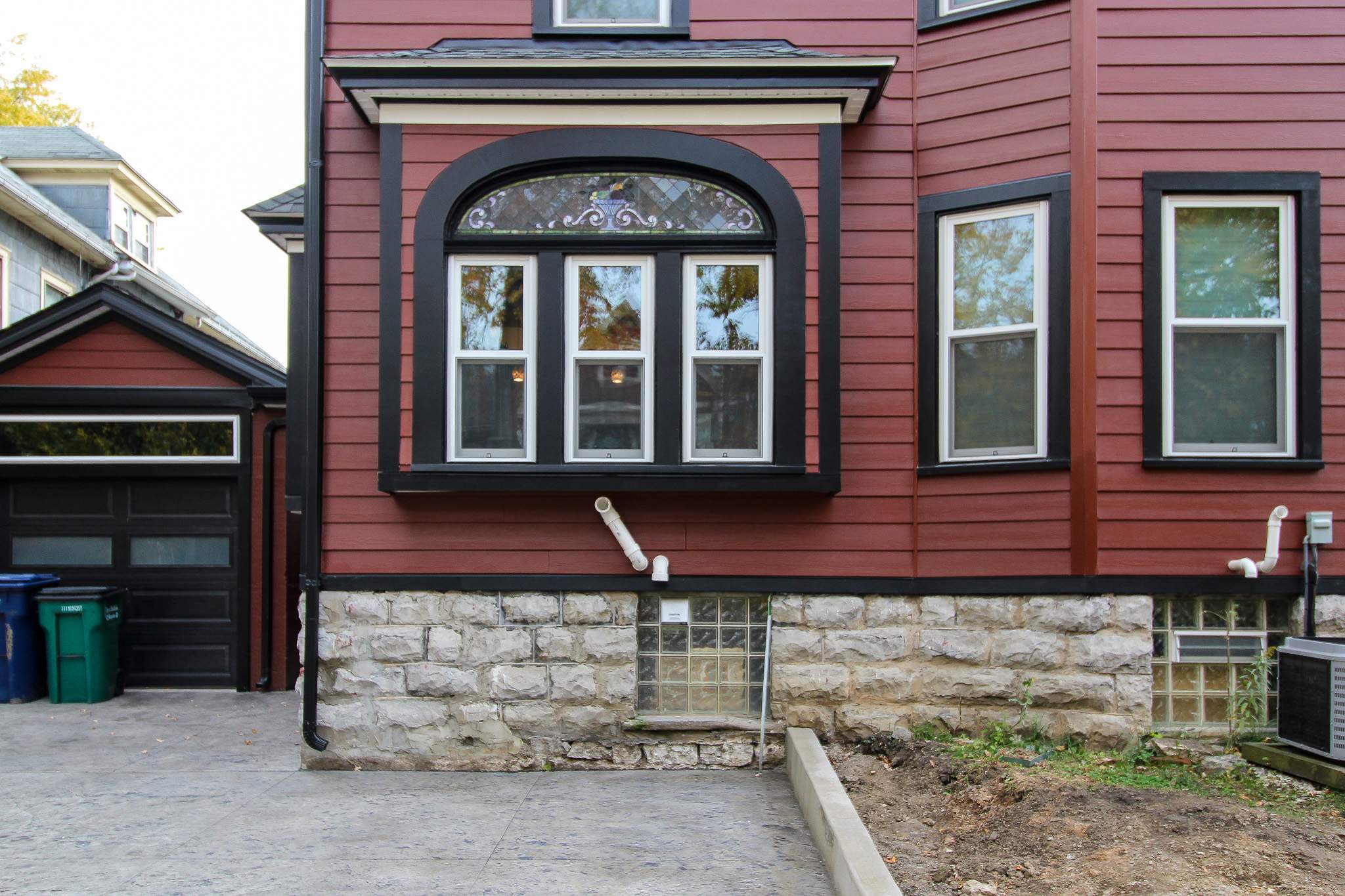 Exterior Renovations- Siding, Stamped Concrete, Porch, and Railings by Ivy Lea Construction