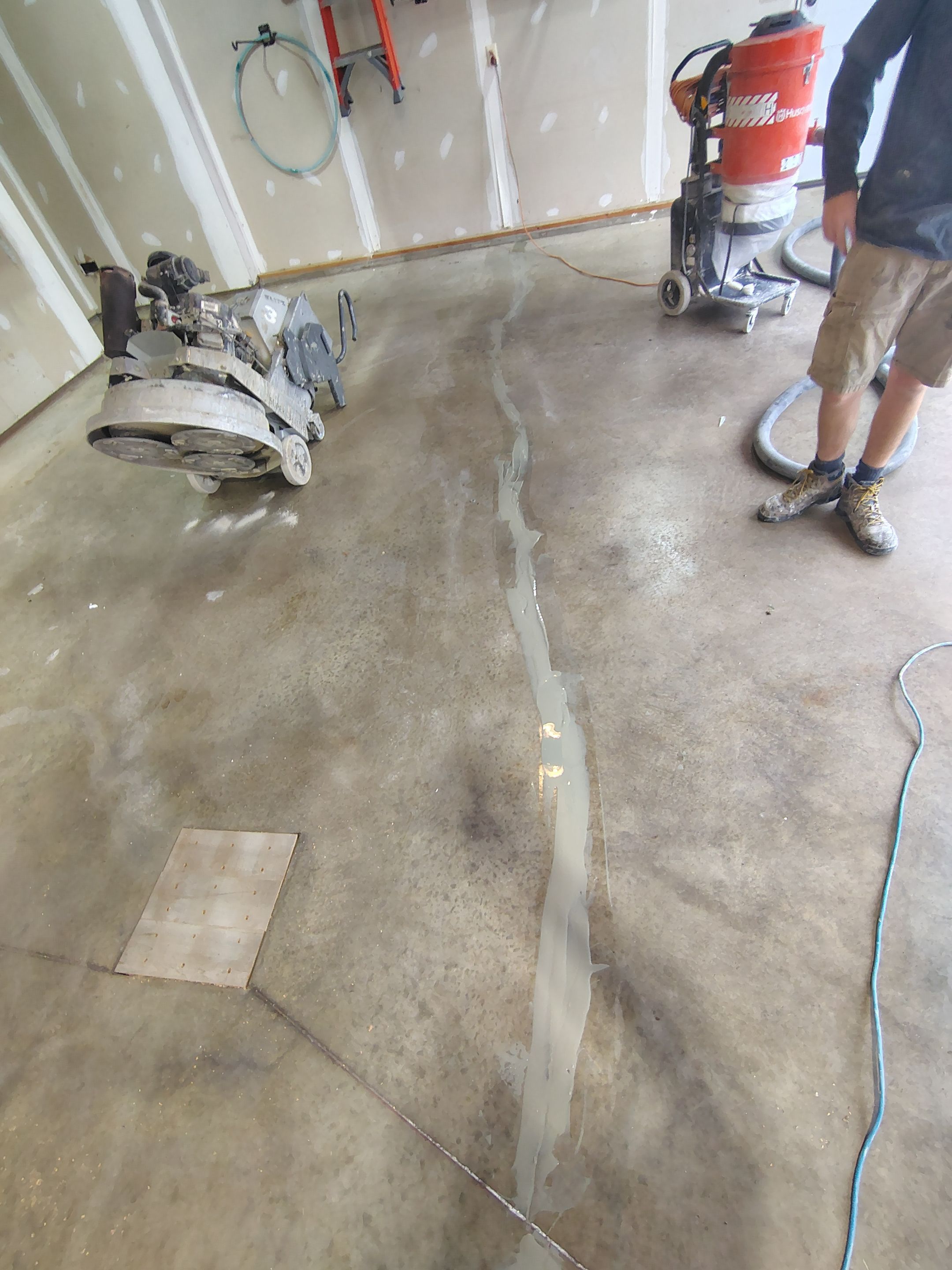 Sioux Falls Garage Concrete Grinding and Nightfall Decorative Chip Coating by Select Painting, Coatings & Garage Cabinets