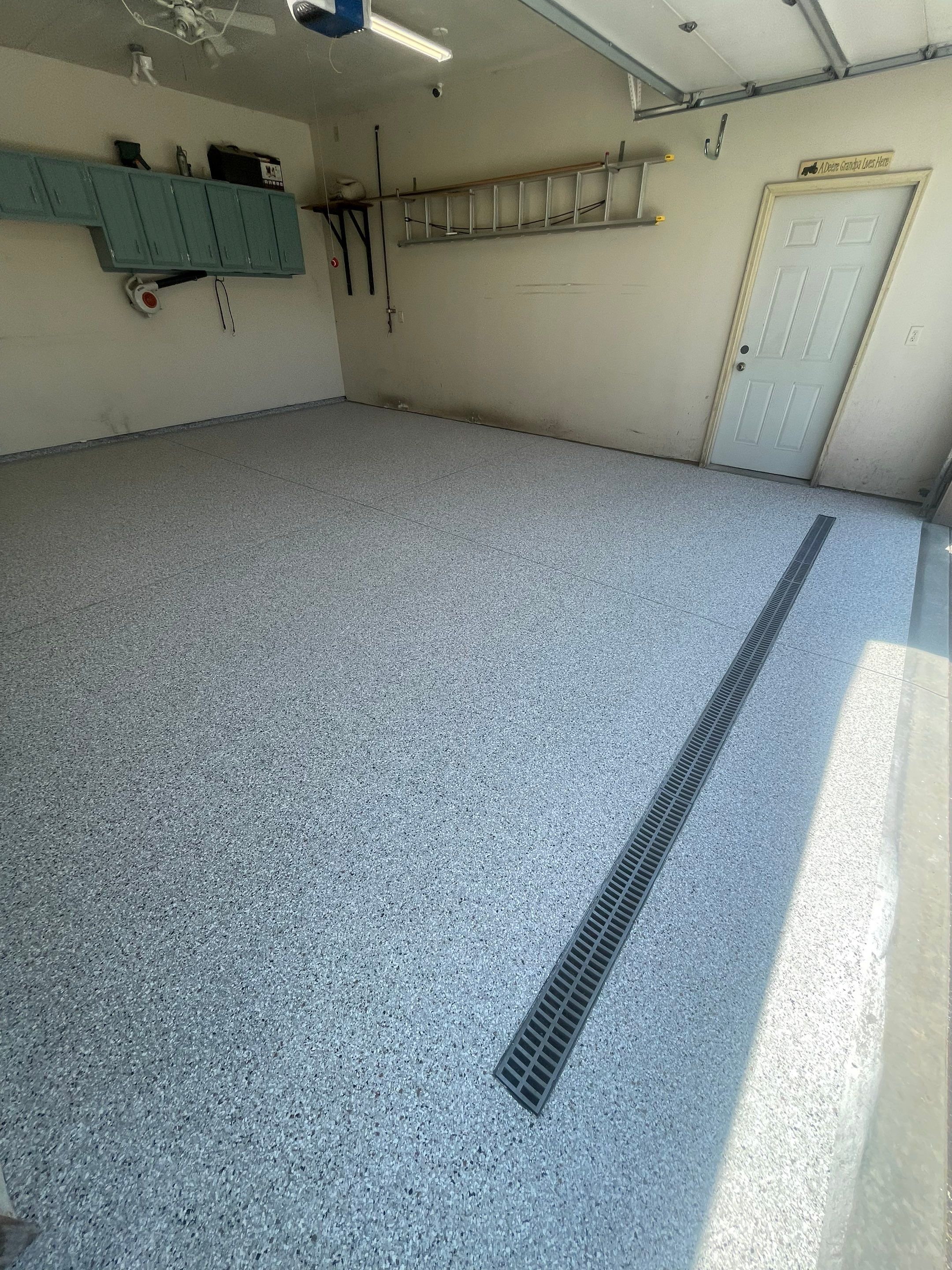Multi-Stall Garage Floor Coating Installation in Sioux Falls by Select Painting, Coatings & Garage Cabinets