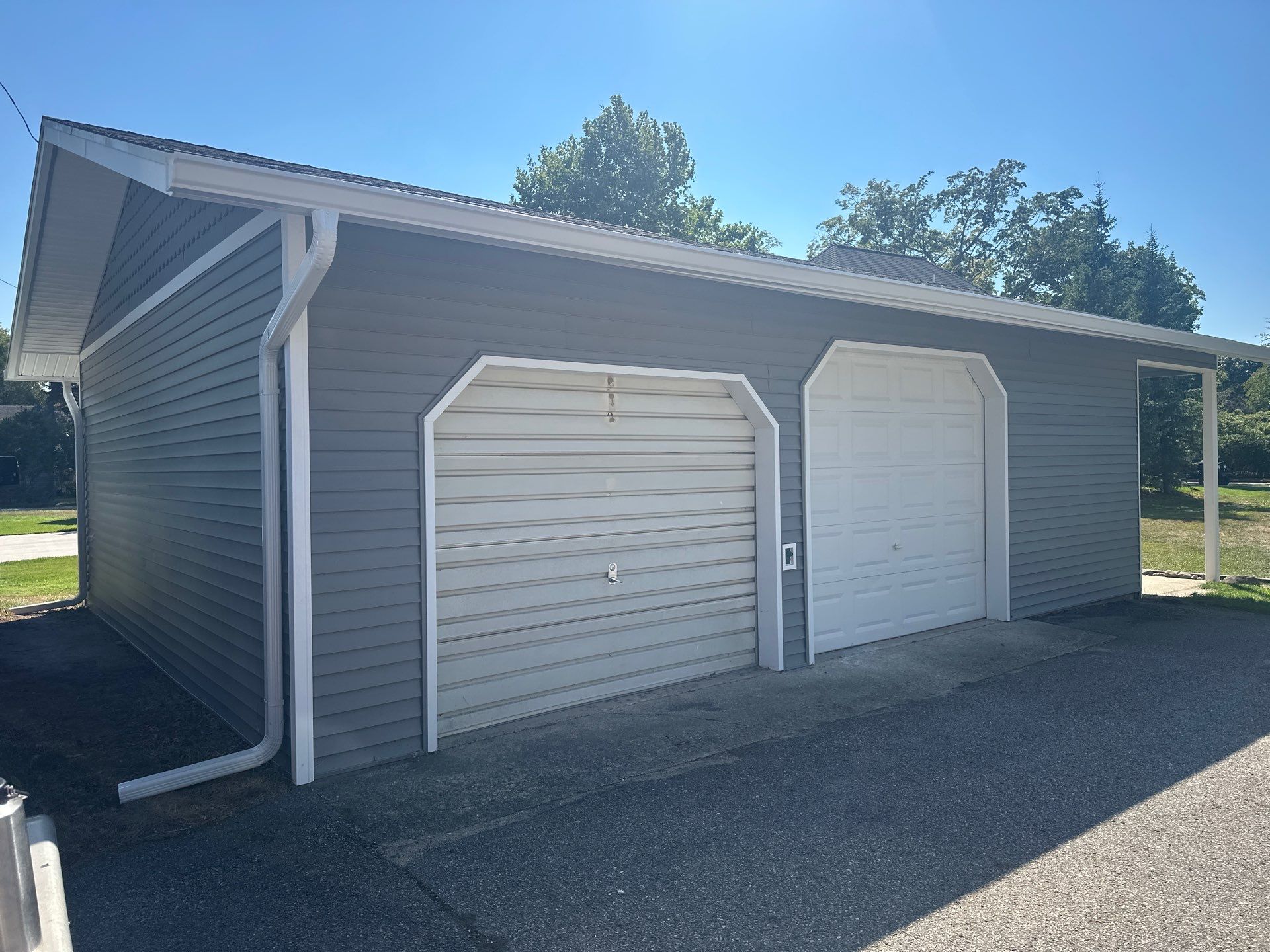 Complete Gutter and Downspout Installation in Charlevoix by Rainbow Seamless Systems