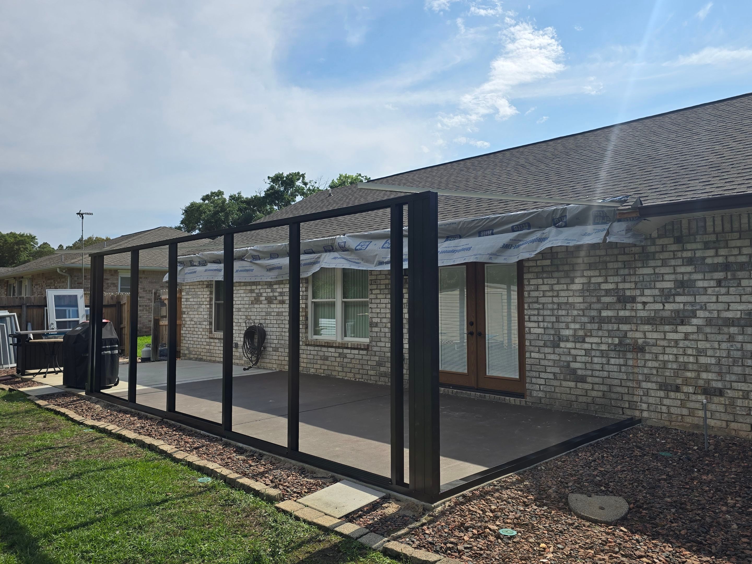 Glass Room & Patio Cover using Colorbeam by Titan Sunrooms