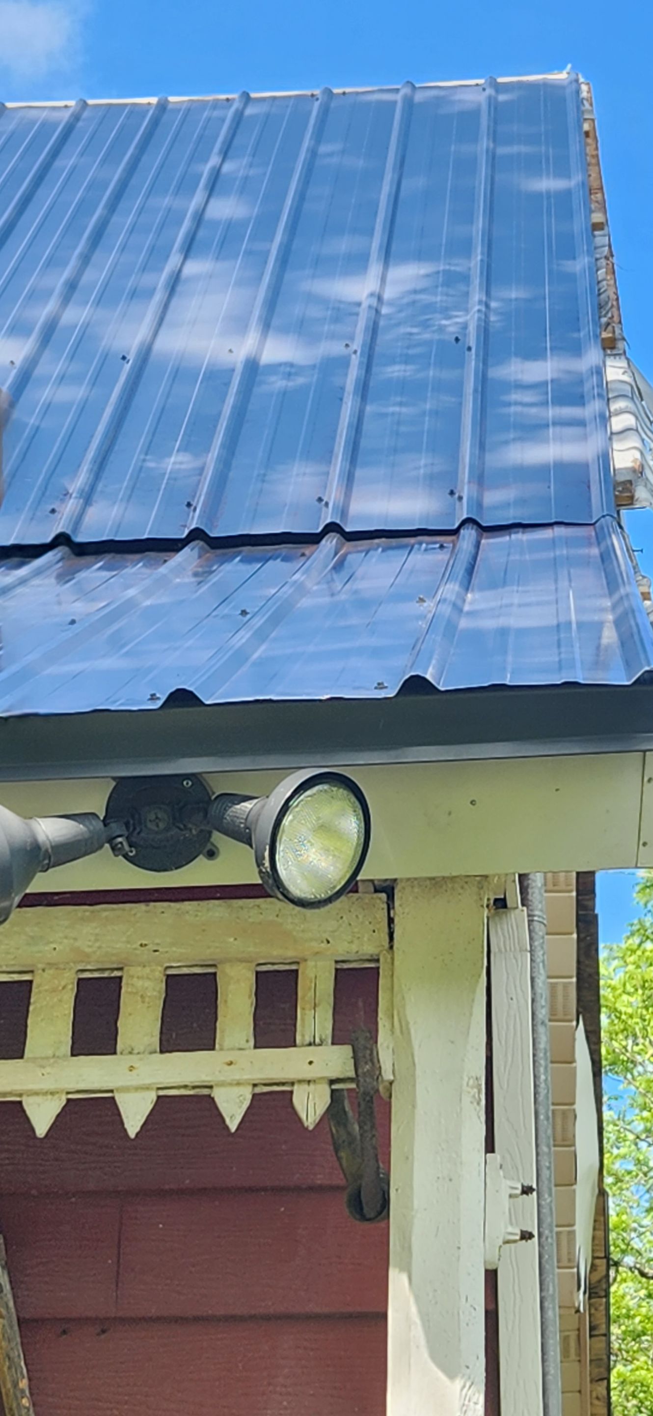 Residential Roofing Installation using 26 Gauge Colored Panels by Hostetler Roofing