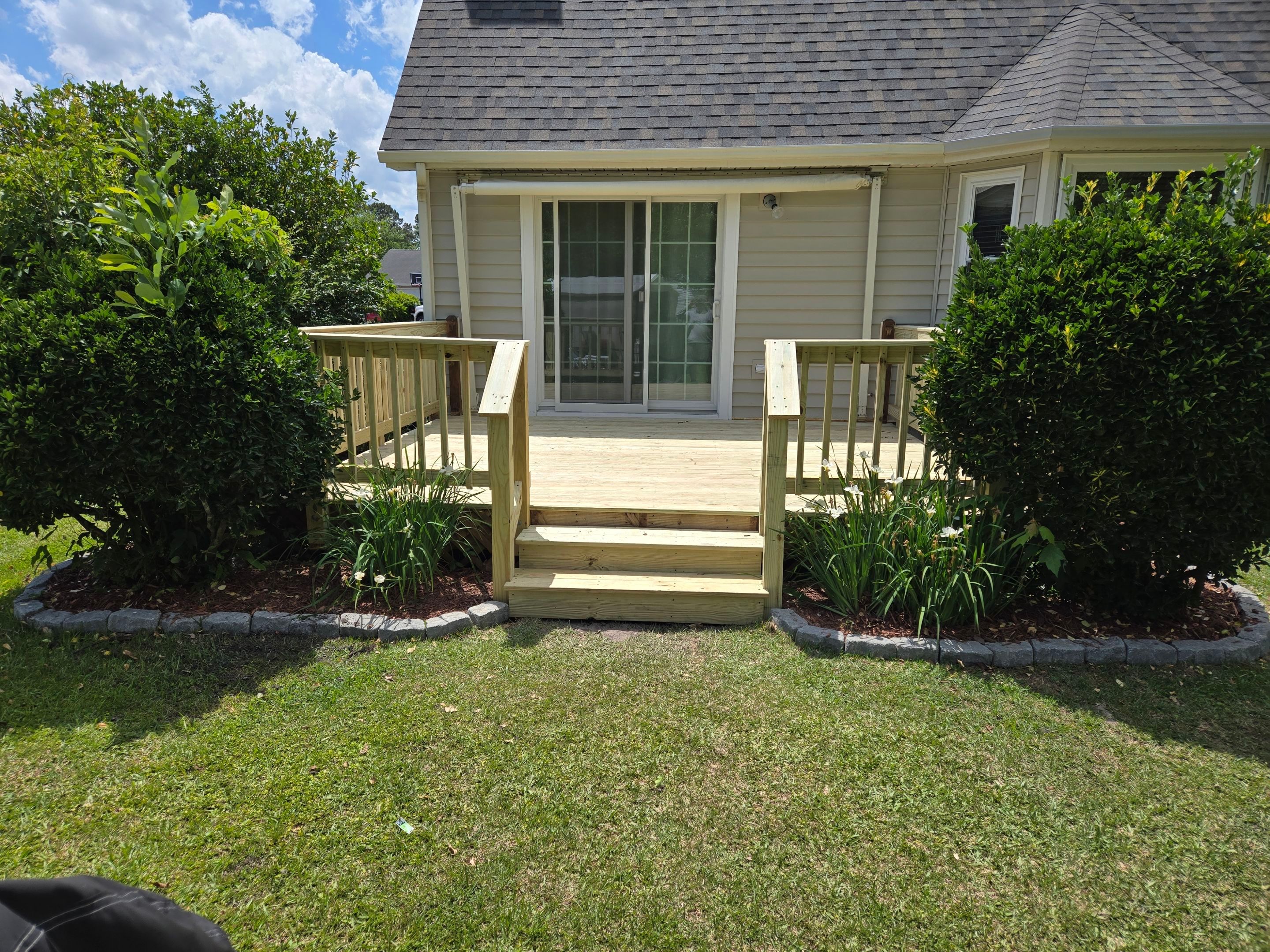 Pressure-Treated Wood Deck Resurface and Railing Upgrade in Havelock by The Remodeling Company